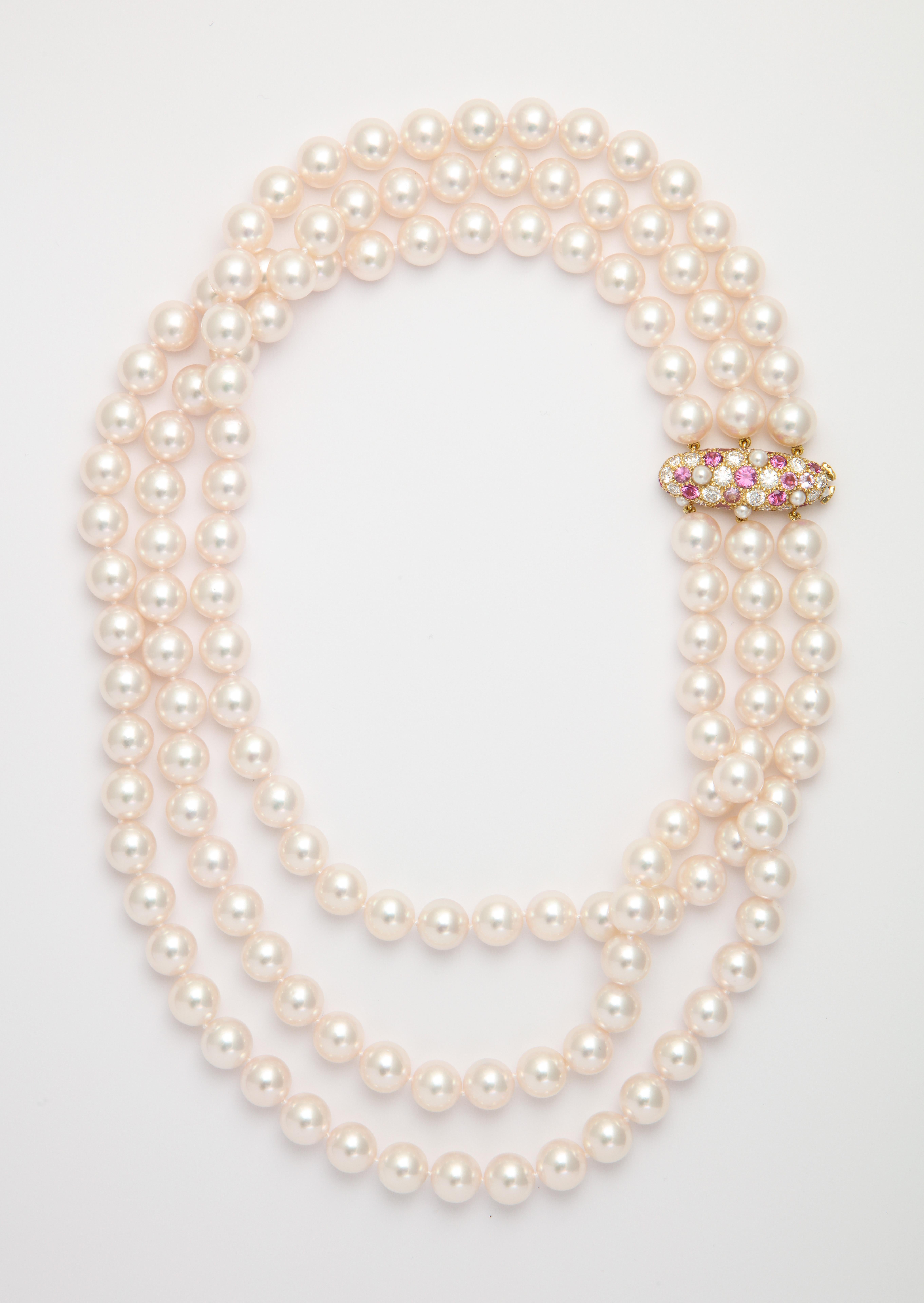 What may have started with Breakfast at Tiffany's is still hot with today's sophisticated woman. This iconic pearl collar is made even more feminine by the use of a handmade custom-designed clasp to play off the rich pinkish hue of the white