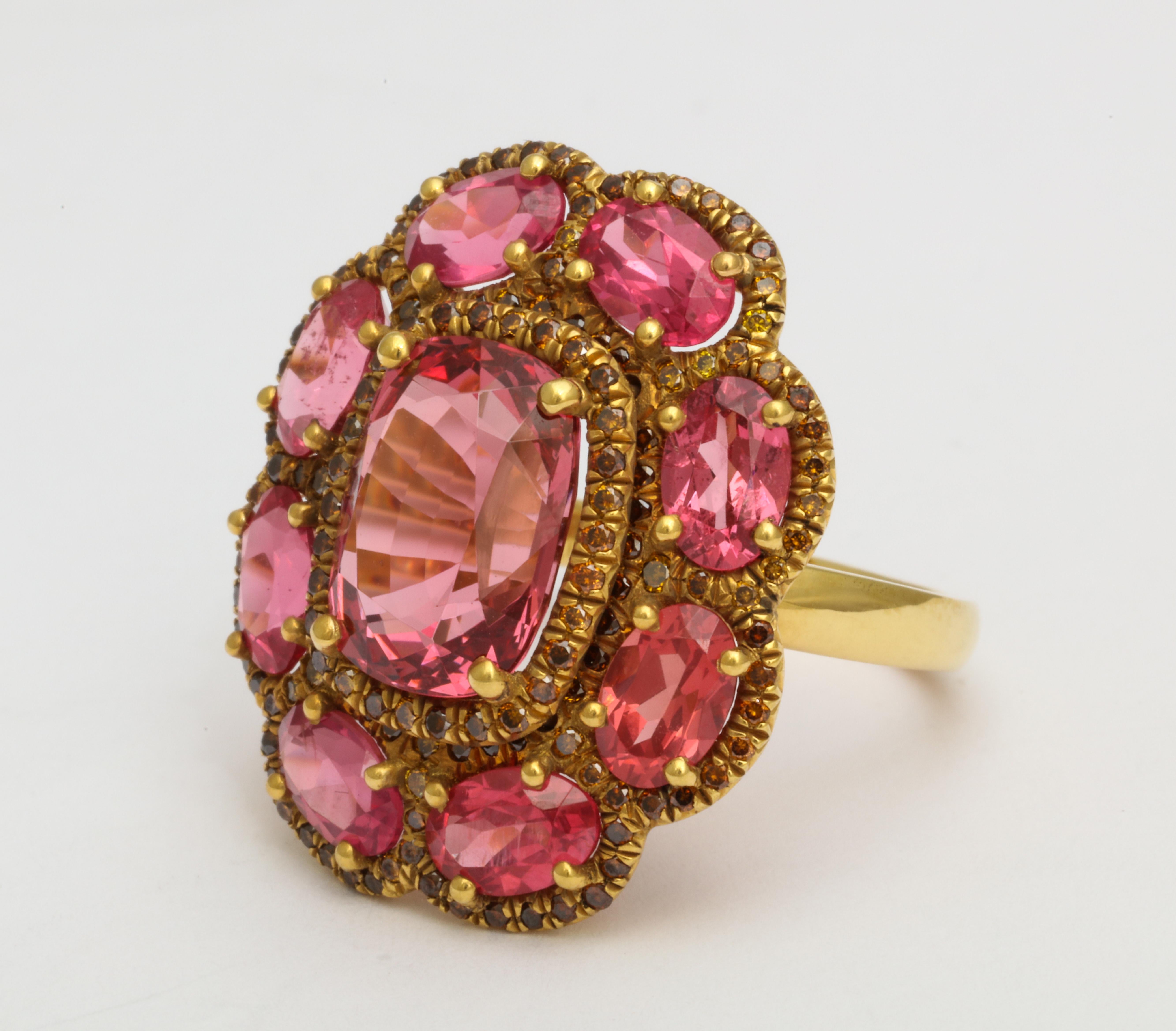 This perfectly romantic designer ring is feminine and sophisticated. Hand made in 20KYG, it features a gorgeous antique cushion cut natural color deep rose pink spinel that weighs 5.13cts. It is surrounded by set of 8 perfectly matched pink spinel