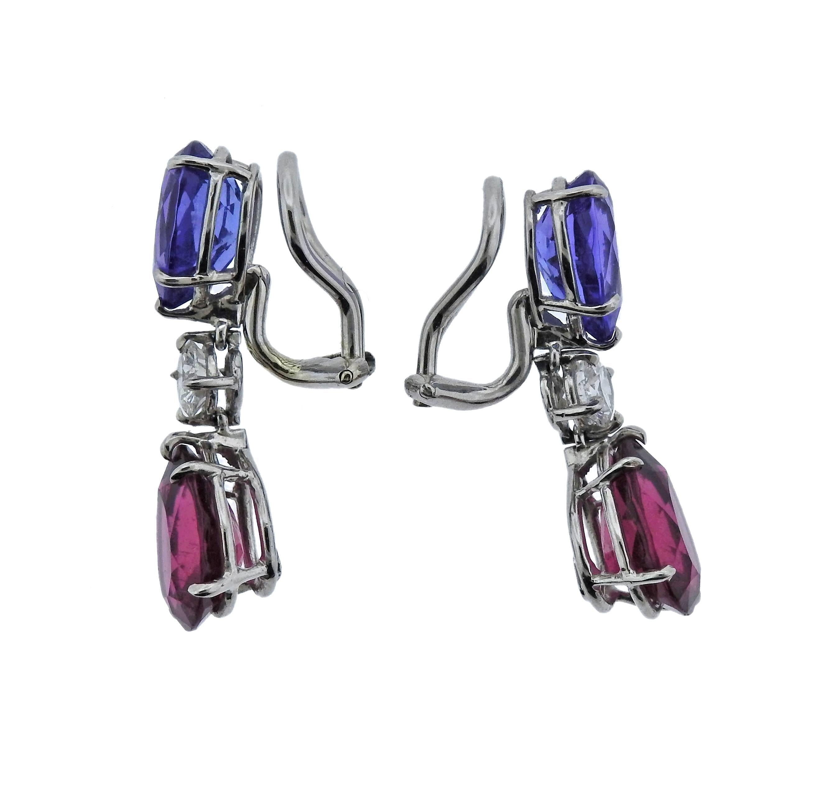 Pair of delicate and vibrant platinum drop earrings, crafted by Donna Vock, set with teardrop pink tourmaline and tanzanite, adorned with approx. 0.65-0.70ctw in G/VS diamonds. Earrings are 28mm x 8mm, weigh 7.6 grams. Marked: Vock and pt950.