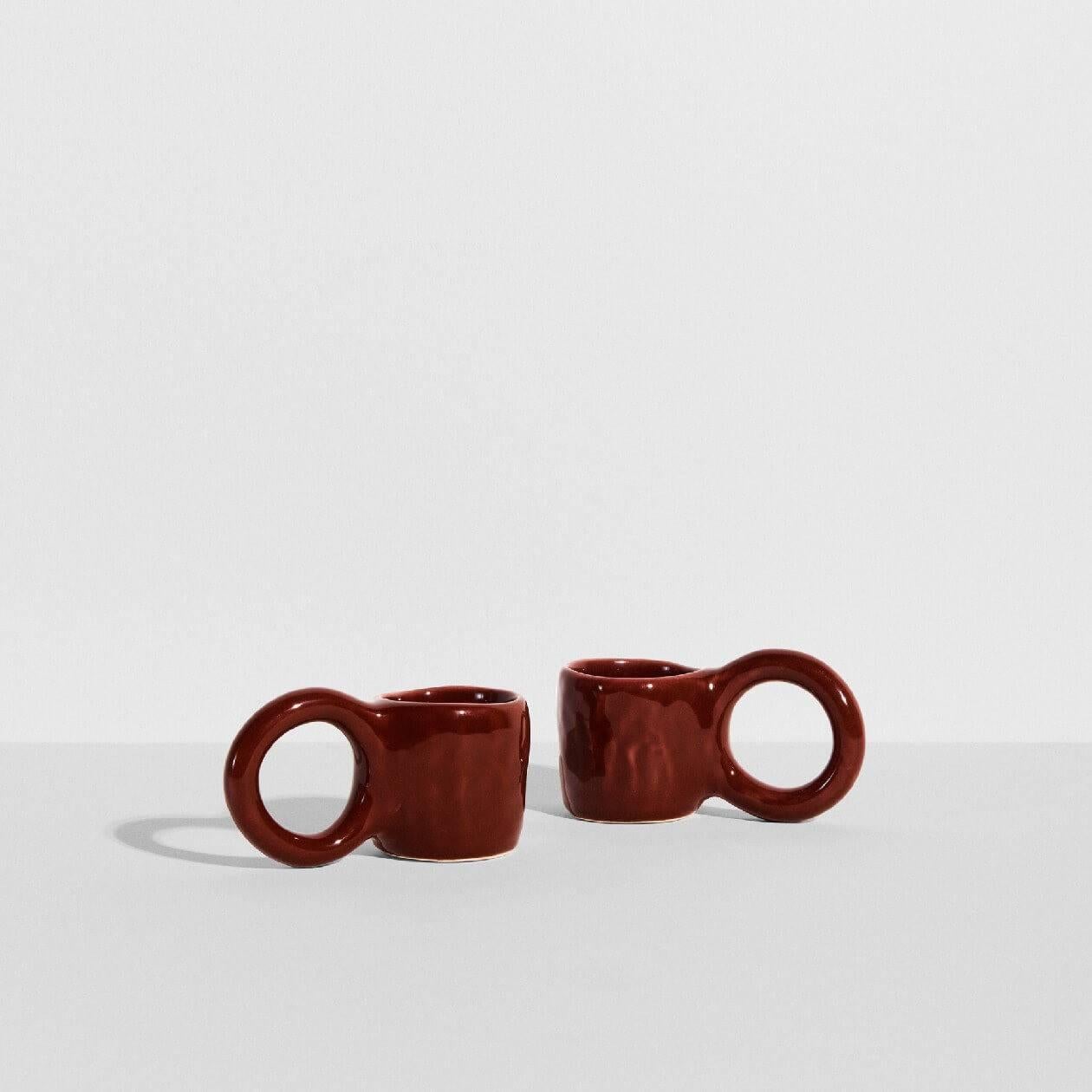 In creating the Donut collection, designer Pia Chevalier drew her inspiration from the world of baking. The ceramic artist designs her espresso like pastries, where the cup handles mimic doughnut pastry, and the enamel finish renders a sugar-glazed