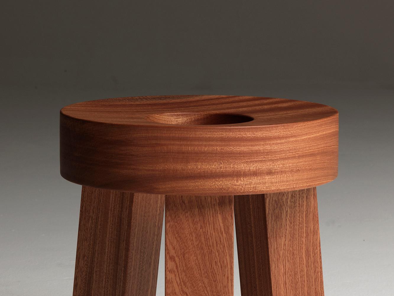 wooden stool with hole in seat