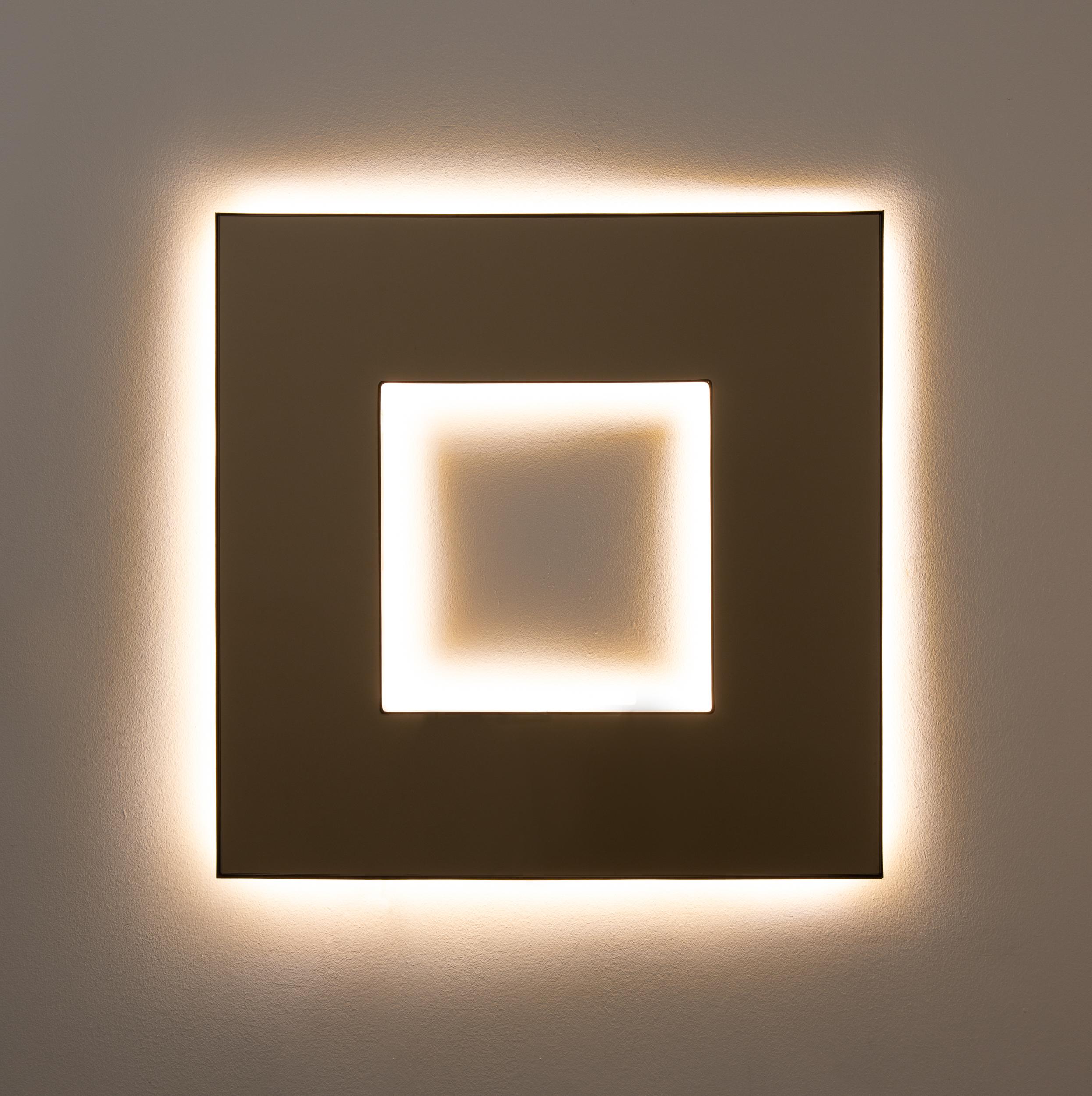 Contemporary Donut™ bronze tinted square mirror with a bronze patina brass frame and back illumination.

The latest creation by mirror designer Jose Luis Alguacil Rodriguez is a very exciting contemporary piece that offers a unique focal point for