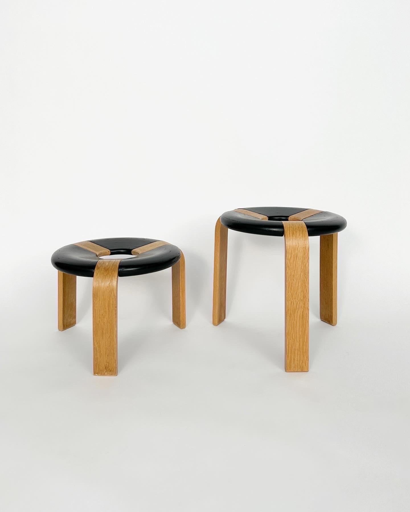 Donut stool designed by Rud Thygesen & Johnny Sørensen in 1974, model No. 4550, produced by Magnus Olesen in Denmark.

This pair comes in the favorable version in oak and black stained wood.

Both in great condition with only minor signs of