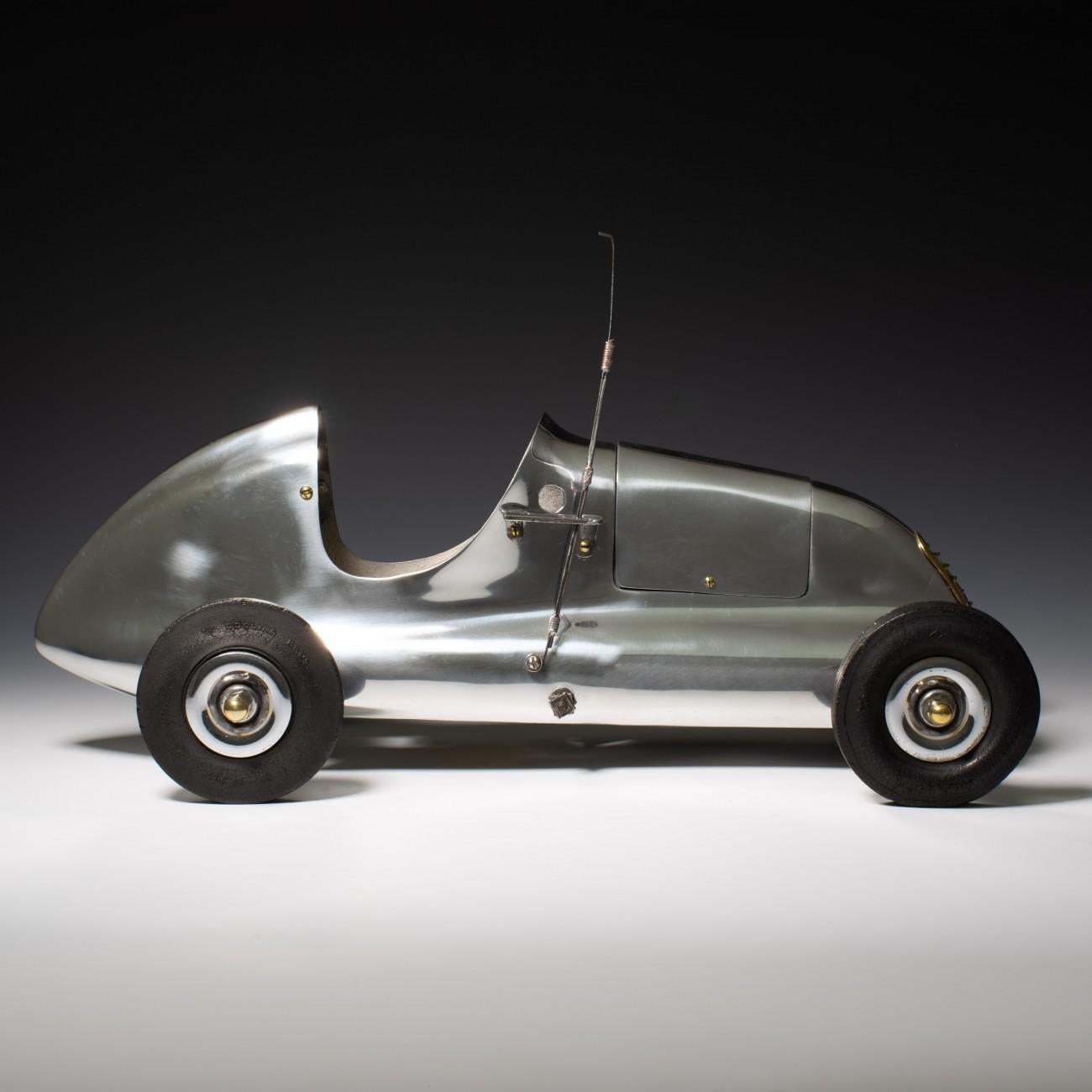 A Fine example of the last of the Dooling Mercury series of cars. It was made in the autumn of 1940 and was known as the Front Drive, or Second Series Front Drive. The body is a one piece aluminum casting with a separate enclosed cast motor