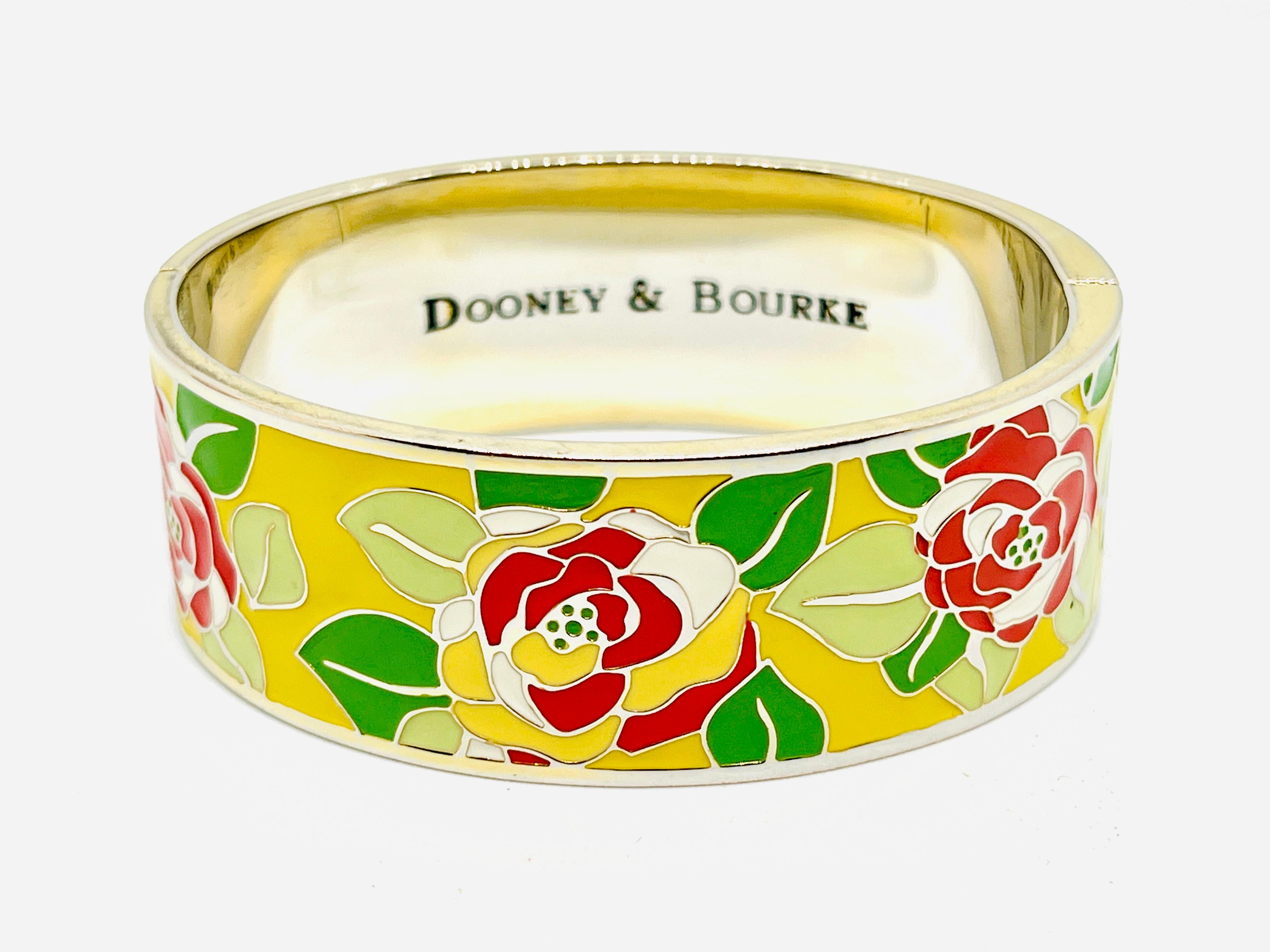 Heat-set enamel yellow rose garden clamp bracelet two maker's marks. Updated cloisonné, features red, yellow, and white rose petals on two shades on green leaves. One on the magnetic closure and one that is stamped on the inside of the bracelet.