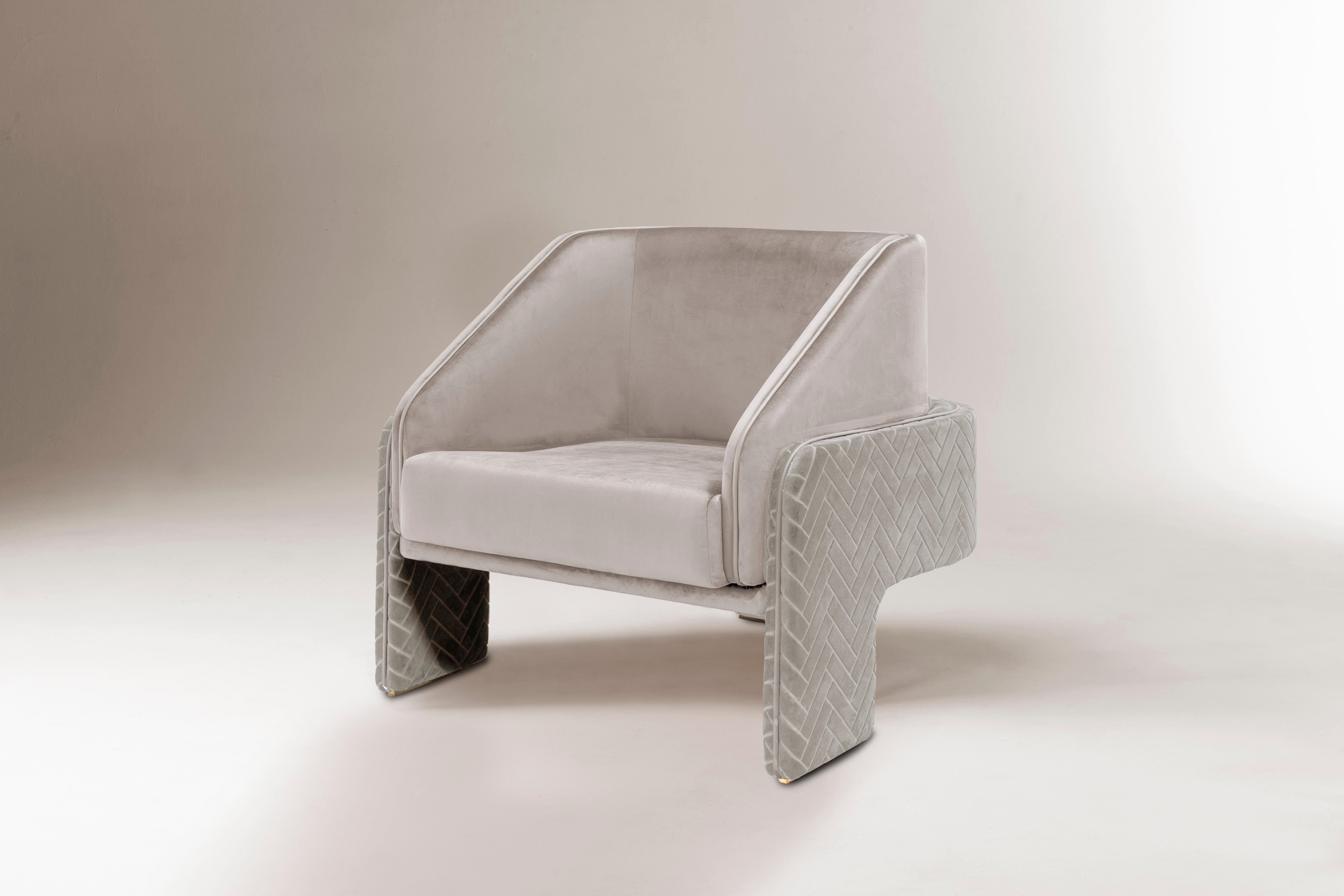 L’Unité armchair is proportional and sculptural, perfectly made to the human scale. It gathers strong upholstered shapes lightly supported on elegant stands. A piece that excites the eye and imagination, inspired by modernist architecture’s style