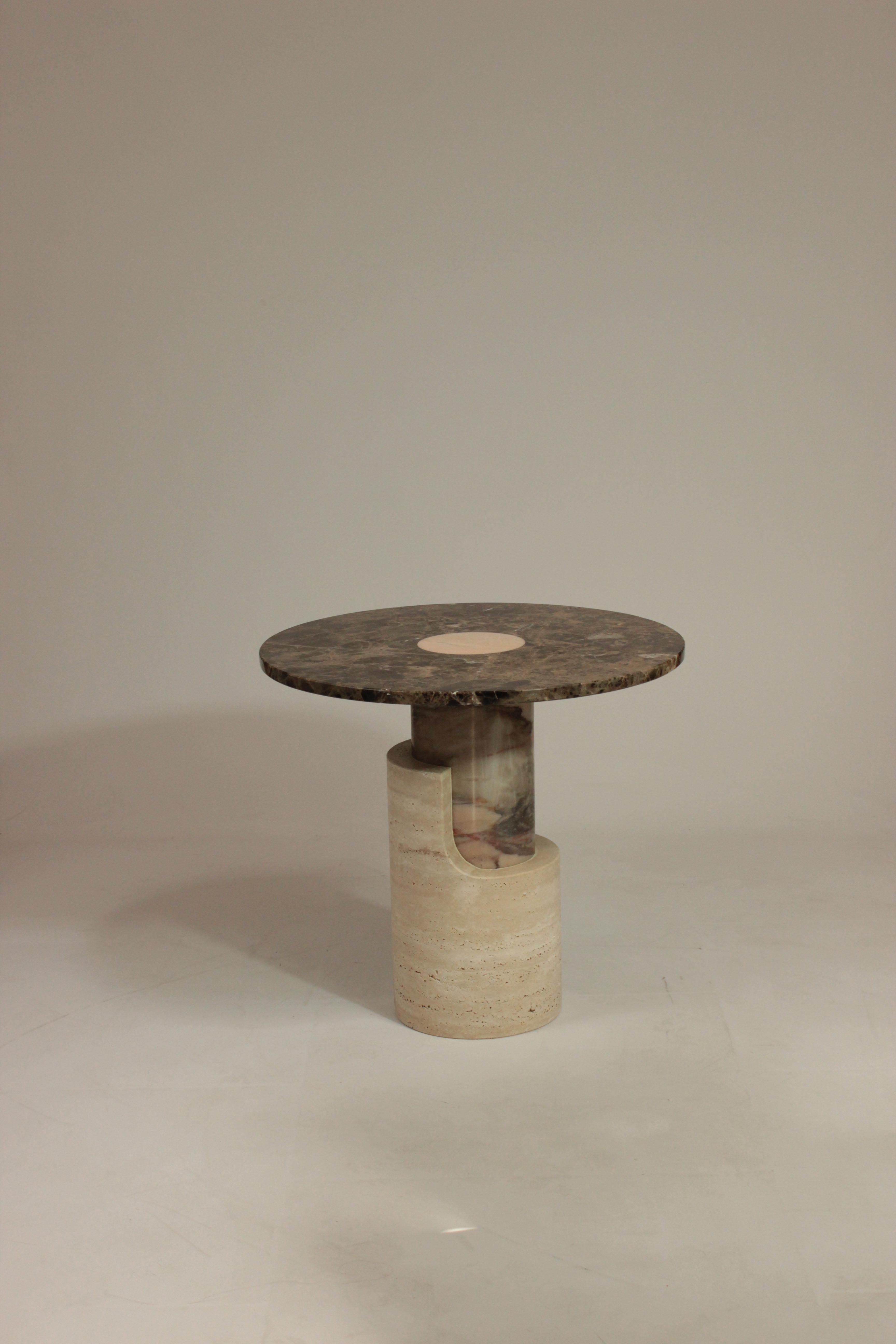 Celebrating a new invented reality, smooth and rough surfaces contrast with one another giving way to a new approach in shape and balance. Braque side table shows a torn and fragmented form, exposing the inner core of its base, which can be seen