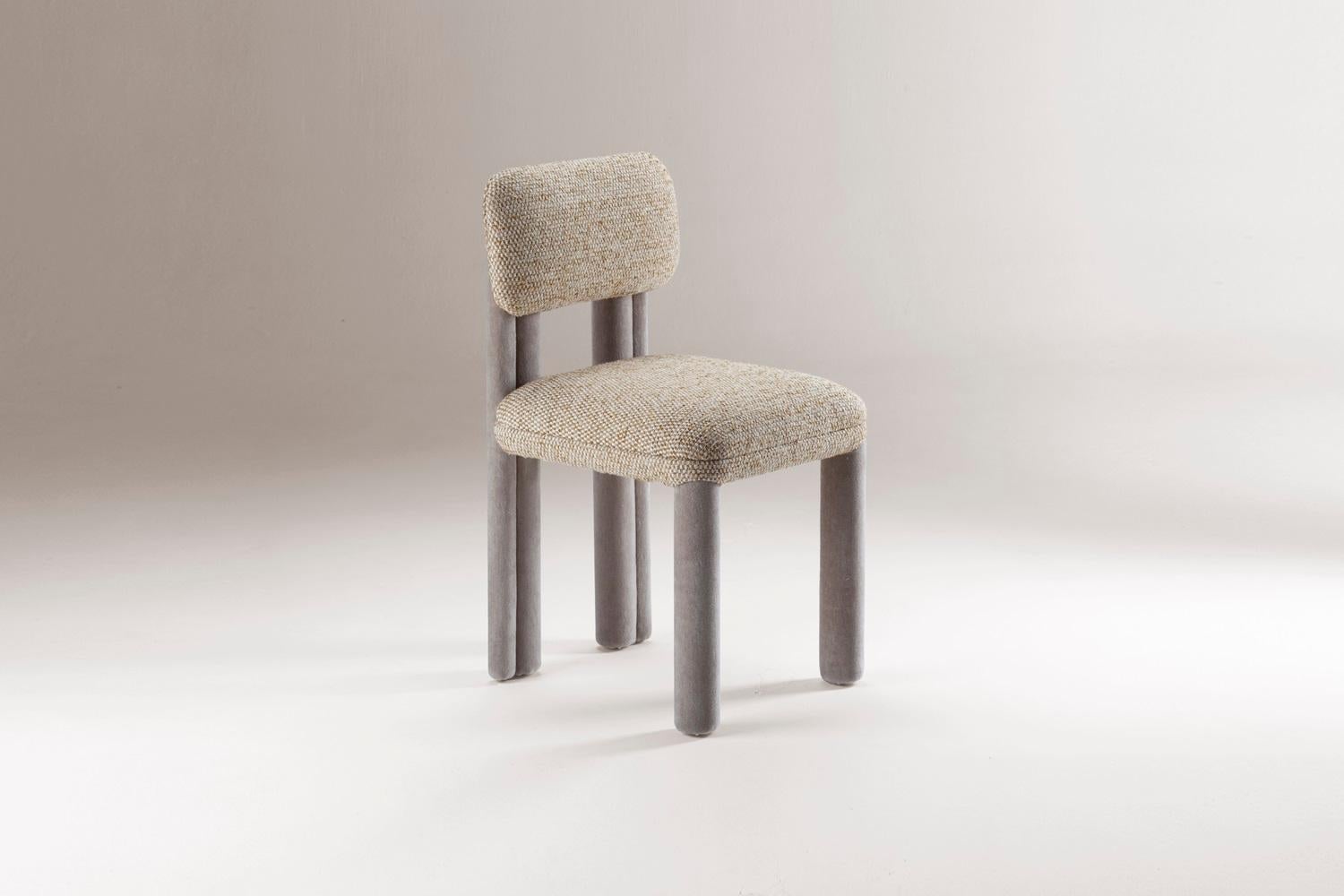 DOOQ New Modern Dining Chair Camelia in Beige and Gray Fabric Fully Upholstered

Introducing Camelia, a chair that gracefully embodies the essence of the Romantic period, channeling its ideals of passion and elegance. With its sensuous curves and
