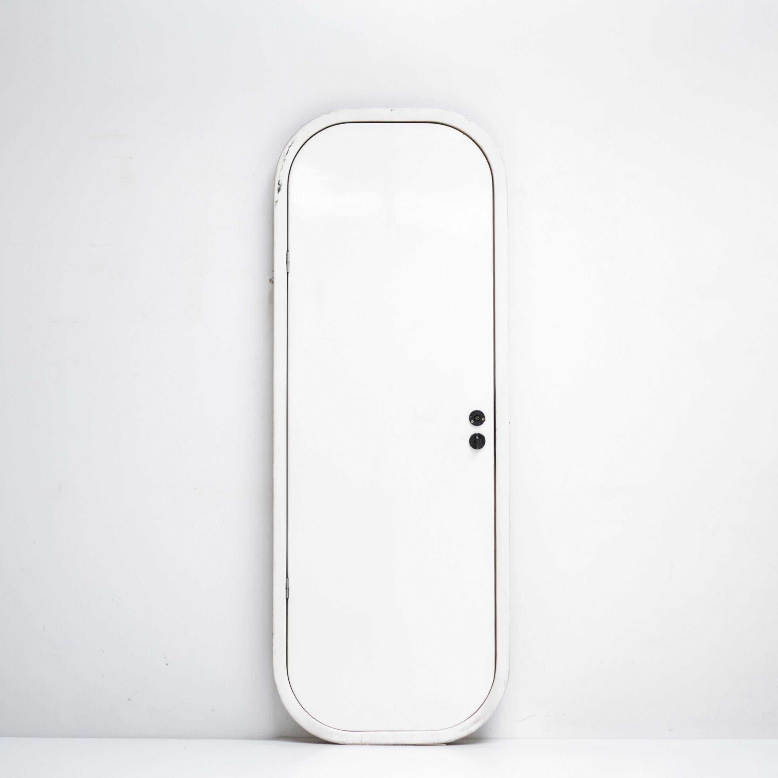 A minimalist door with rounded edges, expressing the architectural vocabulary found in Charlotte Perriand’s projects. Its functional simplicity and gentle form embody Perriand’s vision of human-scaled modernism — where design serves both space and
