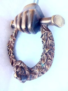 Door knocker Bronze Shaped like a hand holding a laurel wreath, Italy