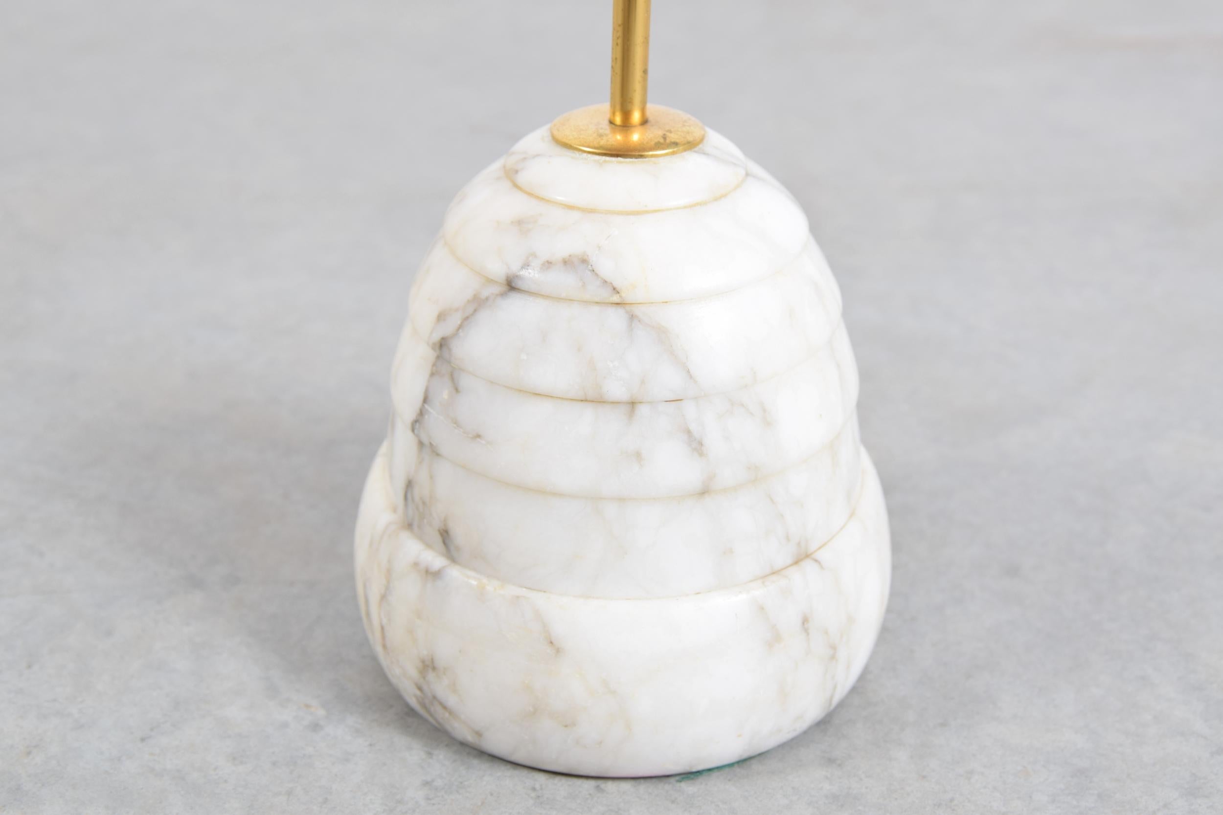 Carrara marble doorstop on brass handle, attributed to Luigi Caccia, circa 1966.