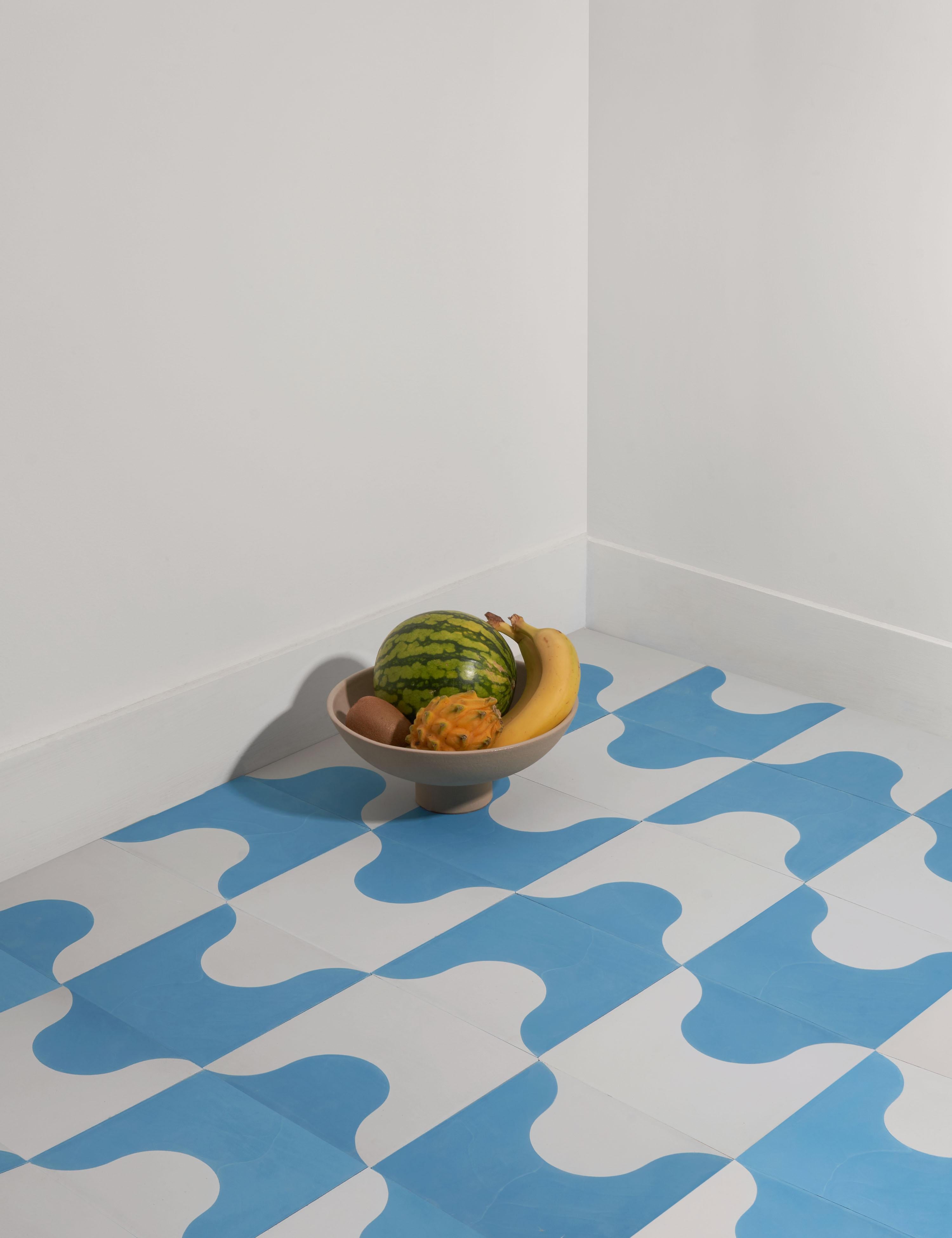 Each color combination of Doozie comes as a pair of modular tiles, and each is the same 2-toned design colored in opposite positions. You can arrange these modules in different ways to create many different patterns — including Ticket, Ziggy, and