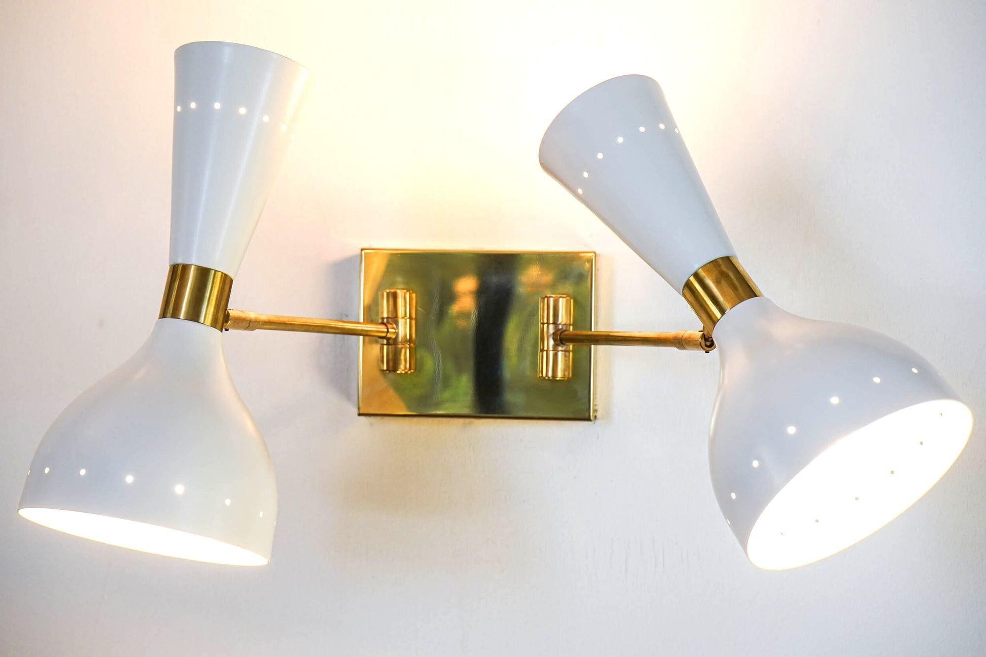 This Doppio chandelier was made several times and finally we decided to list it and made it available.
The twin light diffusers are same as on other products of the same collection. They are called Giano, remembering the Roman god with two