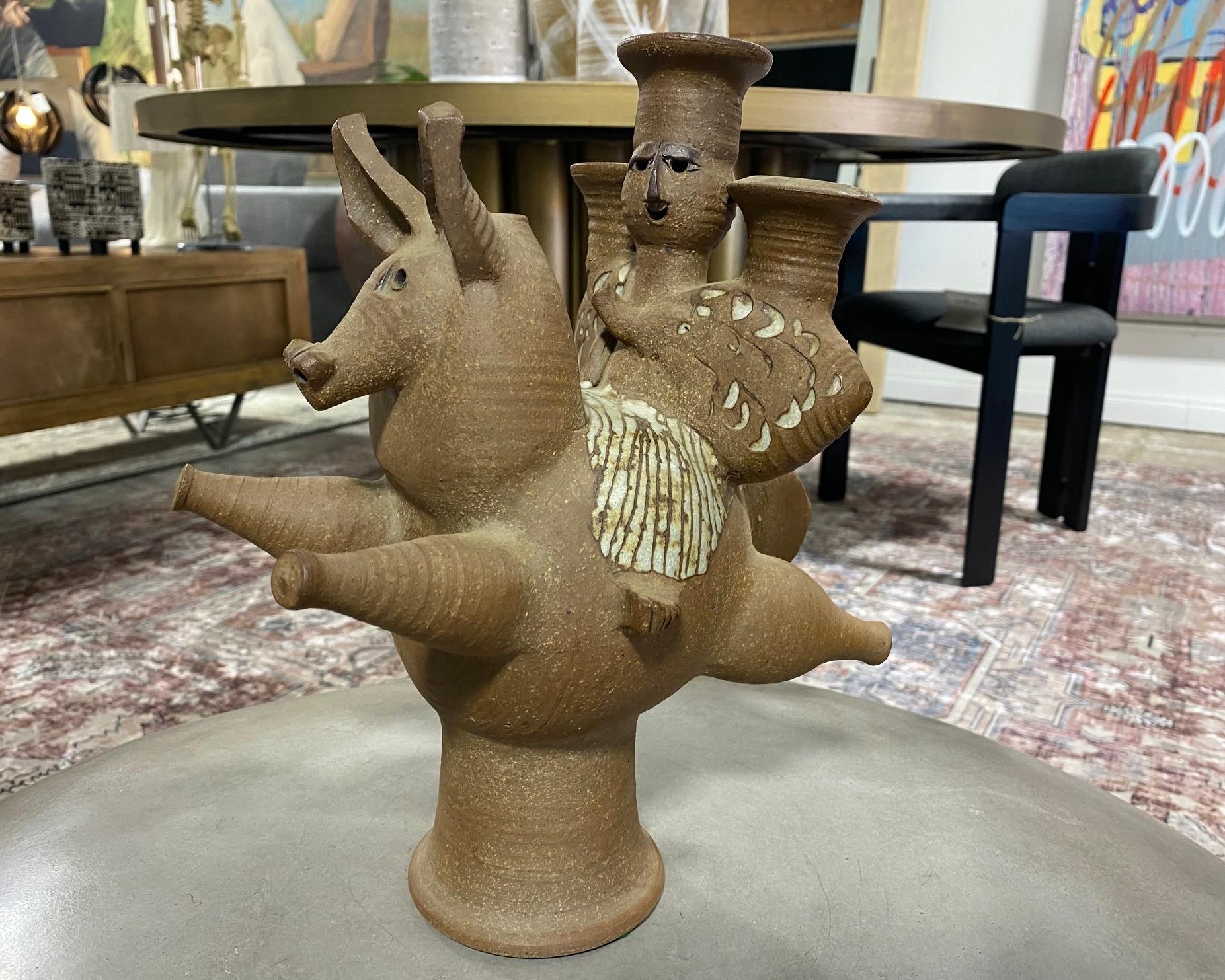 A fabulous, rare, and unique large horse and rider sculpture/ candelabra by famed Mexican American California studio art potter Dora De Larios. It was recently brought to our attention by a collector of her work that this piece was featured in a