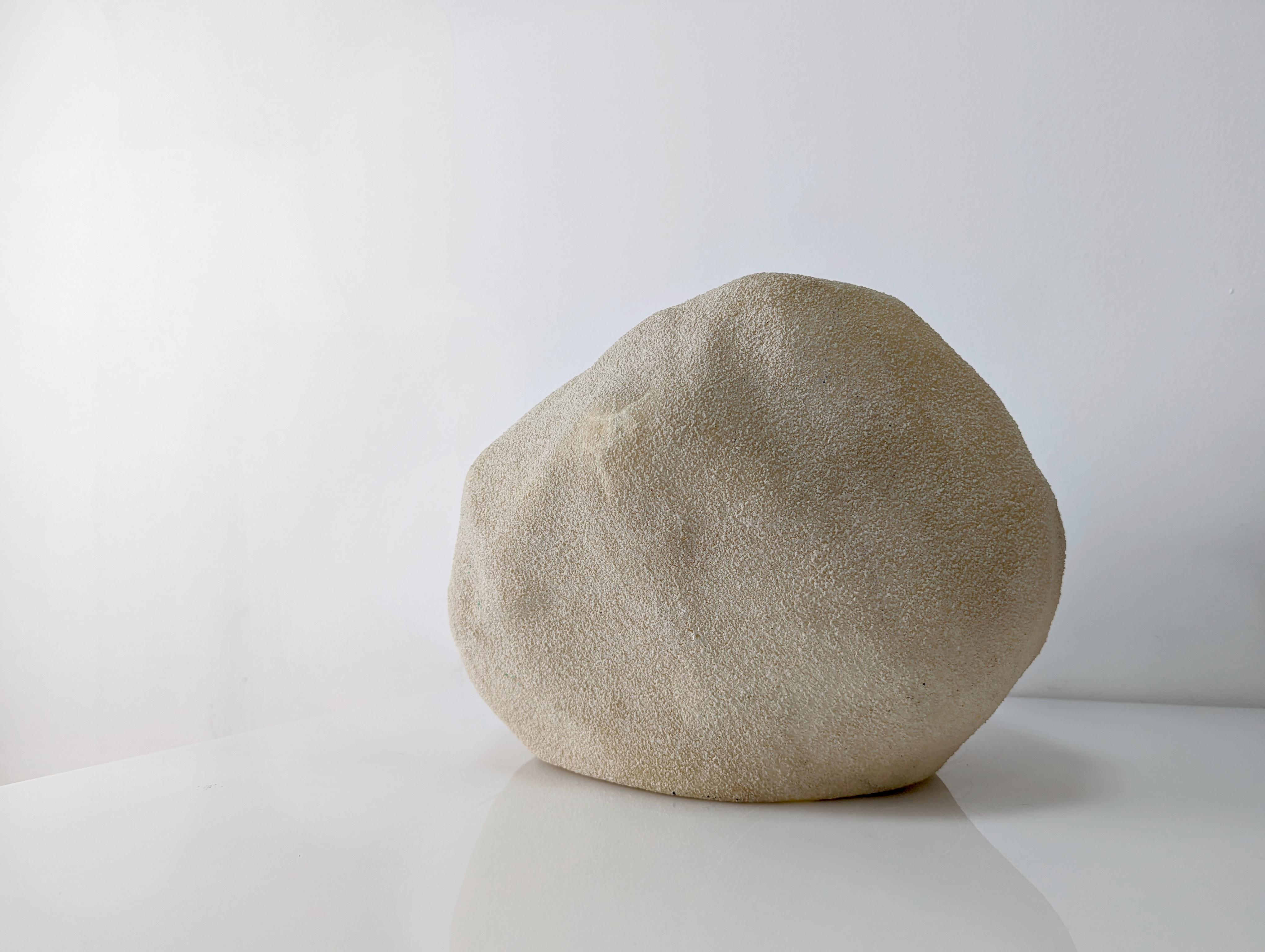 Dora rock lamp designed by André Cazenave for the Italian house Singleton in the 70s. Made of fiber and marble powder, ideal for both indoors and outdoors creating natural and relaxing environments thanks to its soft light.