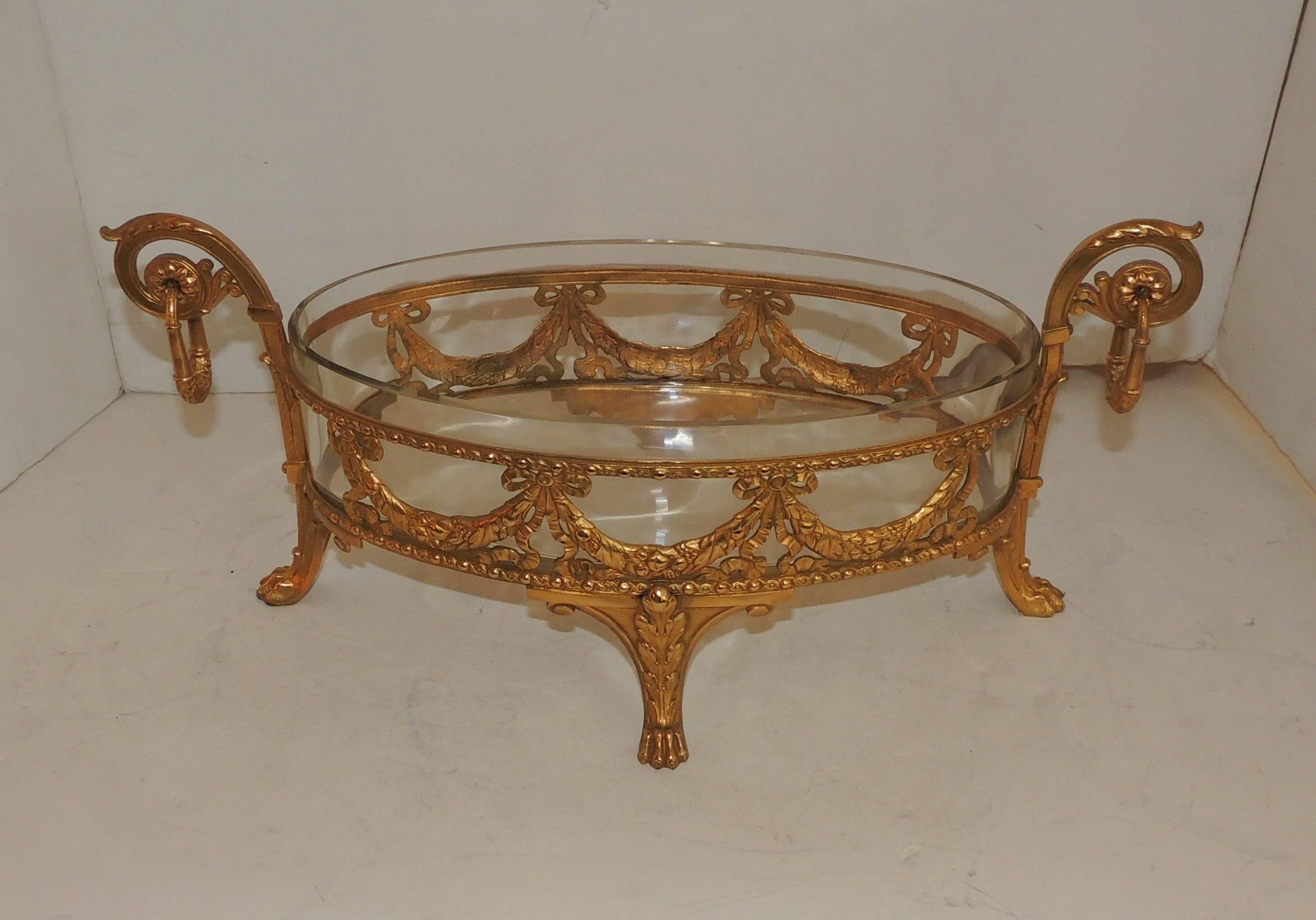 Doré bronze crystal oval bowl centerpiece Ormolu bows filigree swag paw feet.

Measures: 17