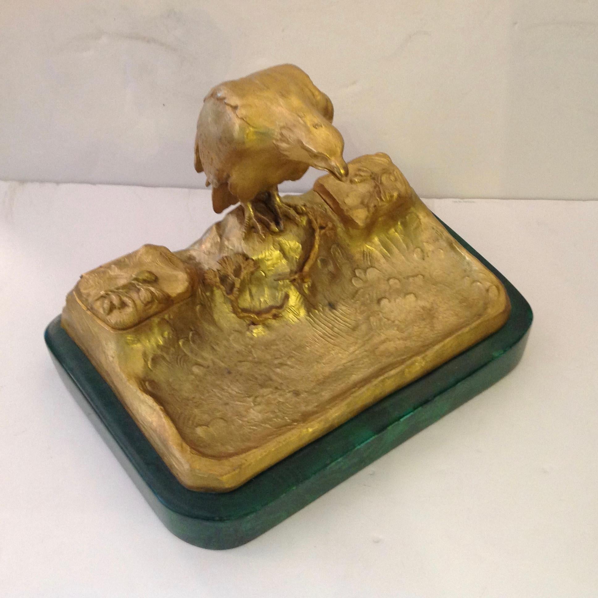 A stunning and finely cast 19th century French inkstand mounted on a malachite like base.