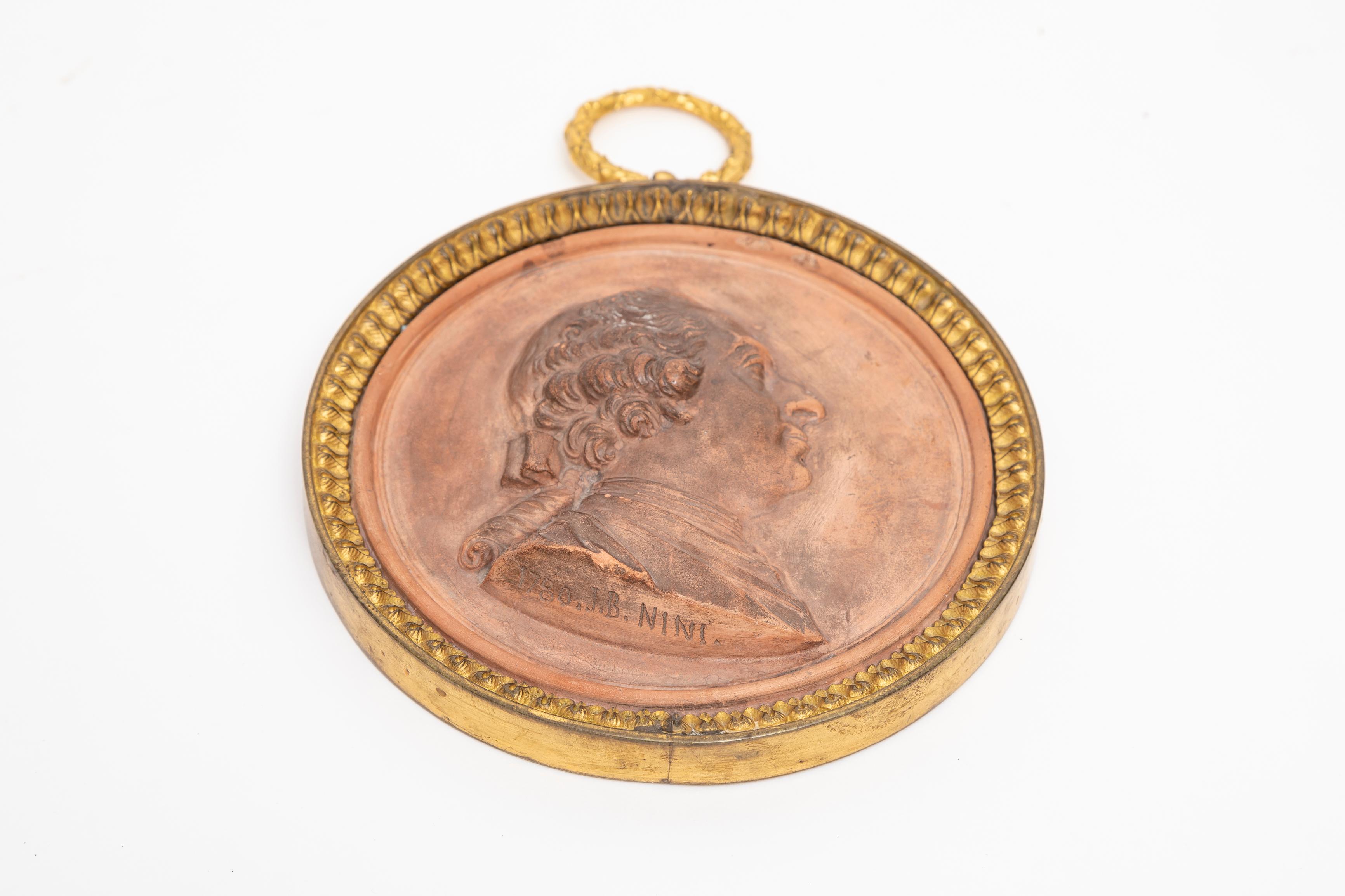 Dore Bronze Mounted King Louis XVI Terracotta Portrait Plaque by Jean-Baptiste Nini, 1780

This remarkable and historically significant antique terracotta portrait plaque bears the signature of the artist, Jean-Baptiste Nini, renowned for his