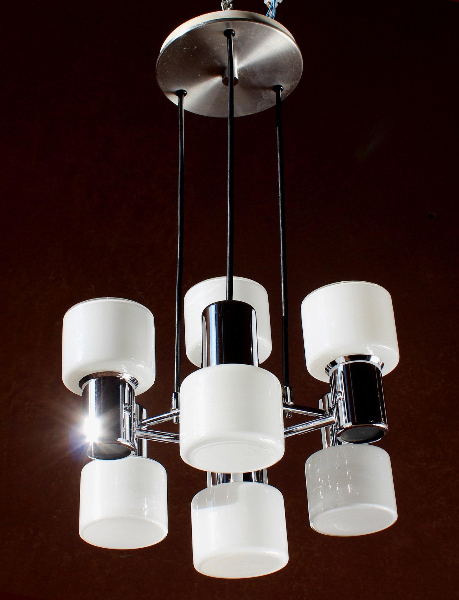 ELEGANT DORIA MODERNIST CHROMED, OPAL GLASS CEILING LAMP GERMANY 1970s

DIAMETER 14,5 INCHES HEIGHT OF THE BODY 11,5 INCHES TOTAL ORIGINAL HEIGHT 25 INCHES

The gorgeous 8 lights (E14) ceiling light is in nearly perfect original condition, careful