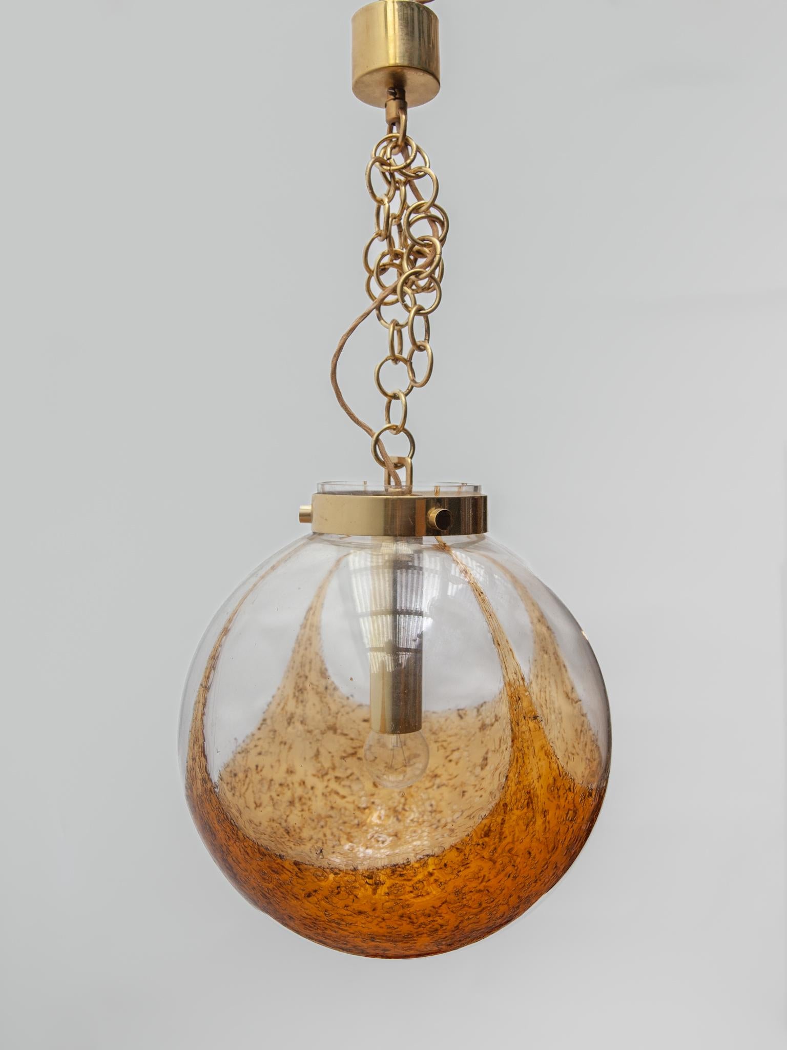 Mid-Century Modern Doria Amber and Clear Glass Globe Pendant. For Sale
