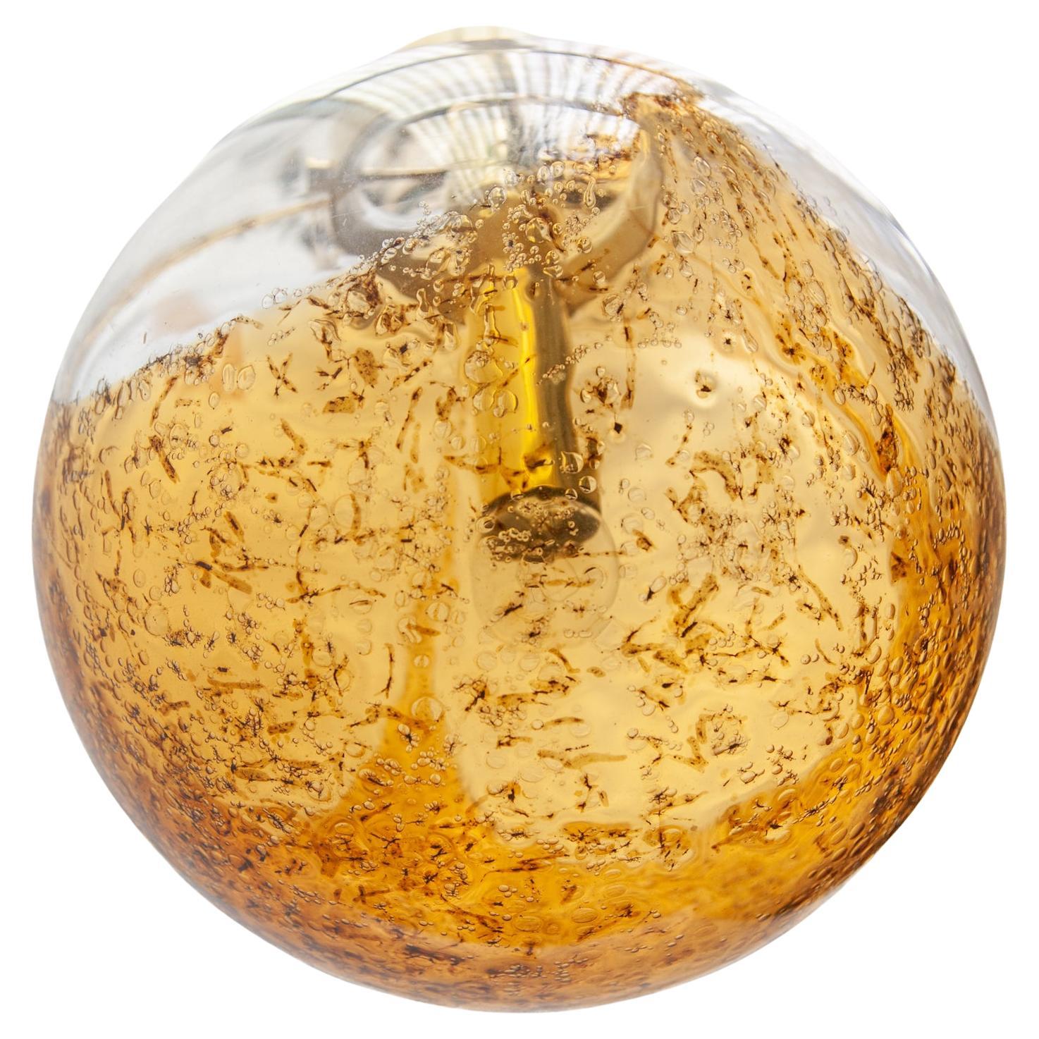 Doria Amber and Clear Glass Globe Pendant. For Sale