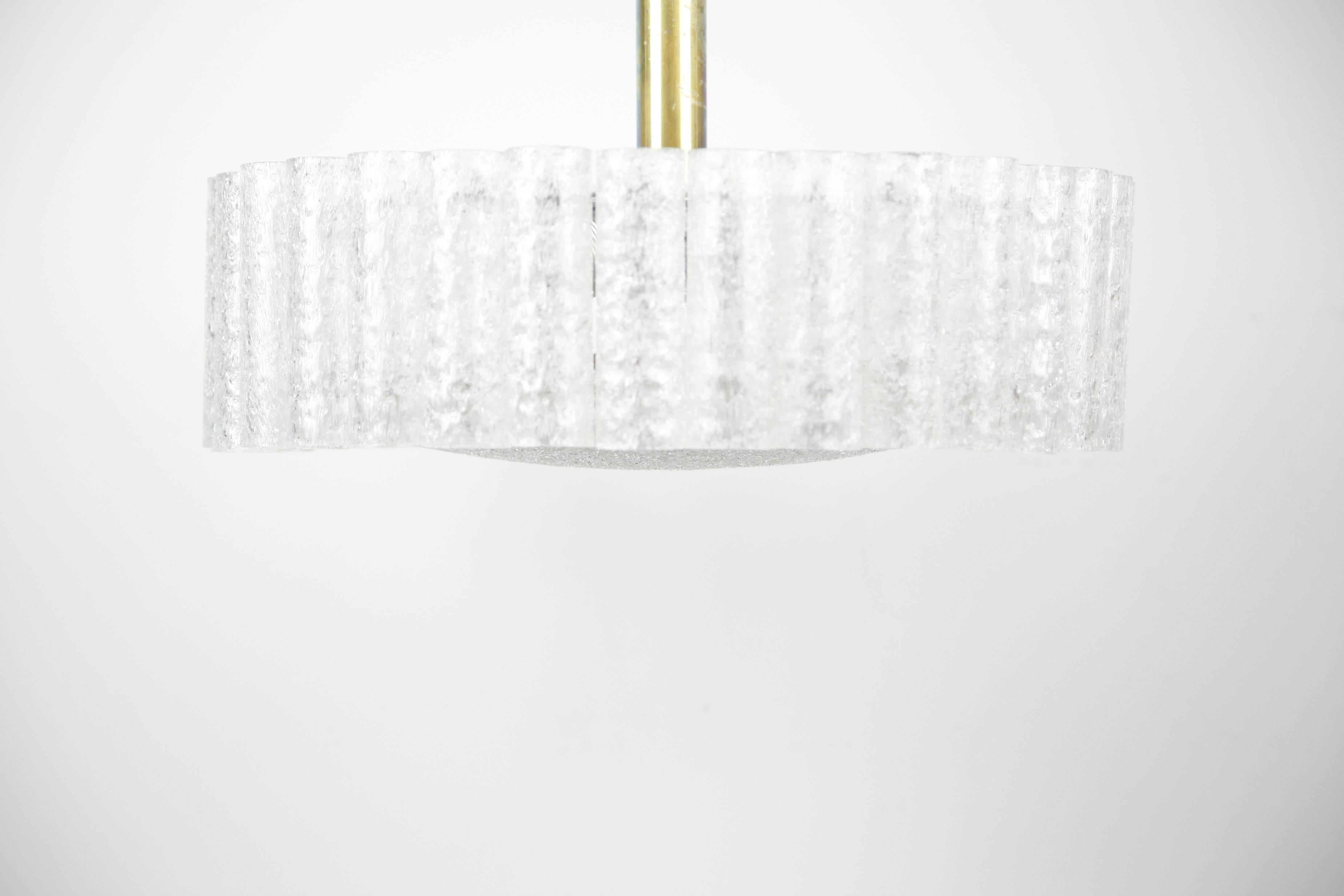 Doria glass tube chandelier from the 1960s, Germany, a metal frame with 32 frosted glass tubes a frosted glass diffuser surrounded by a high polished brass disc with light patina, all original with manufacturer sticker.
Six sockets.
   
  