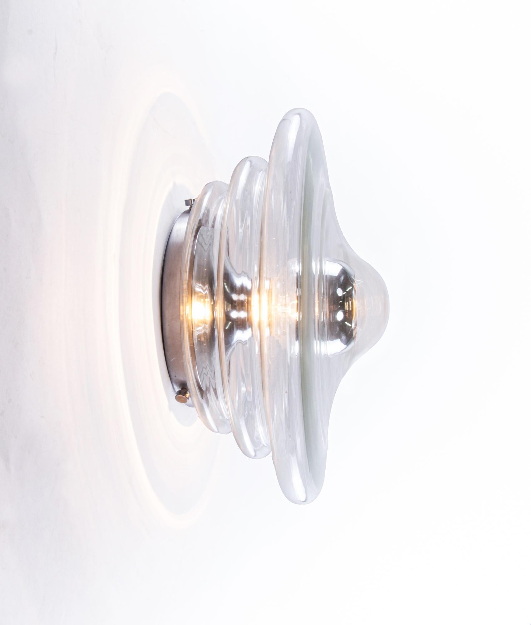 Elegant space age flush mount and wall sconce with a transparent Murano glass shade on a silver metal frame. Gem from the time. With this light you make a clear statement in your interior design. A real eyecatcher even unlit. Manufactured by Doria