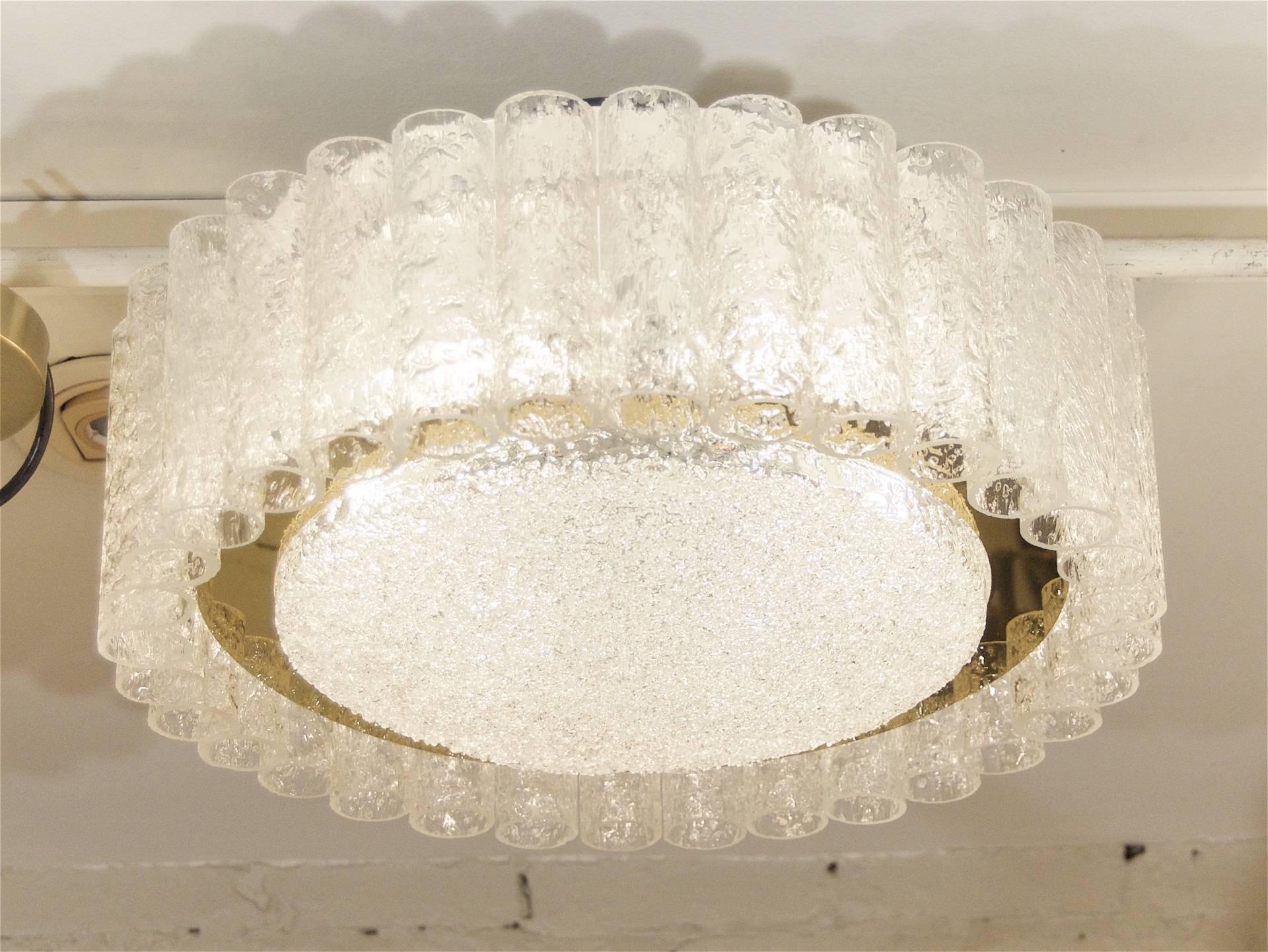 Elegant flushmount chandelier with organic glass tubes and a centre glass disc surrounded by a band of brass. 

Takes six medium base bulbs up to 60 watts each. New wiring.

Height listed is of chandelier body only with flushmount installation.