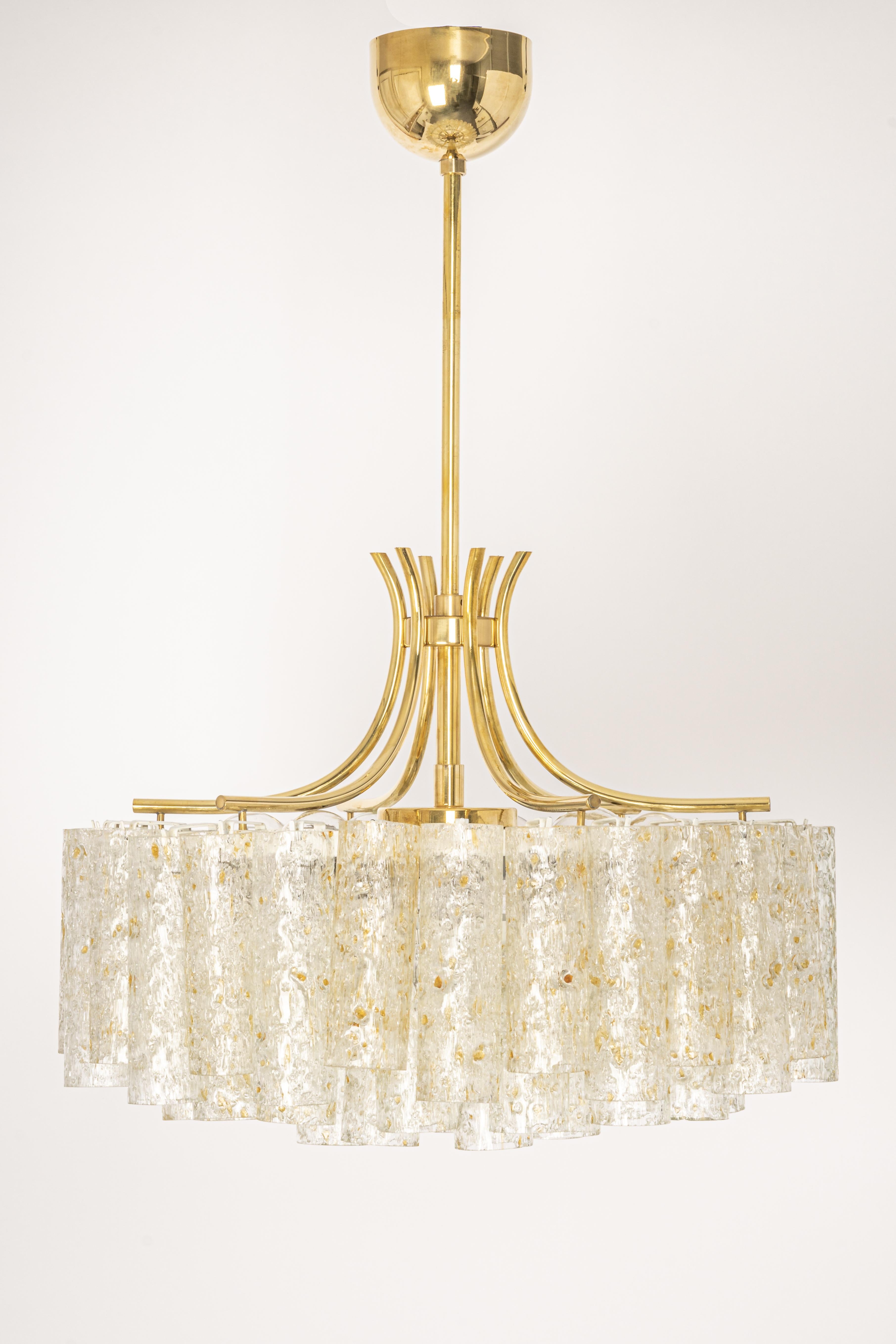 Fantastic three-tier midcentury chandelier by Doria, Germany, manufactured circa 1960-1969. Three rings of Murano glass cylinders suspended from a fixture.

Sockets: Six x E14 candelabra bulbs (up to 40 W each) + one x E27 Standard Bulb( up to 60