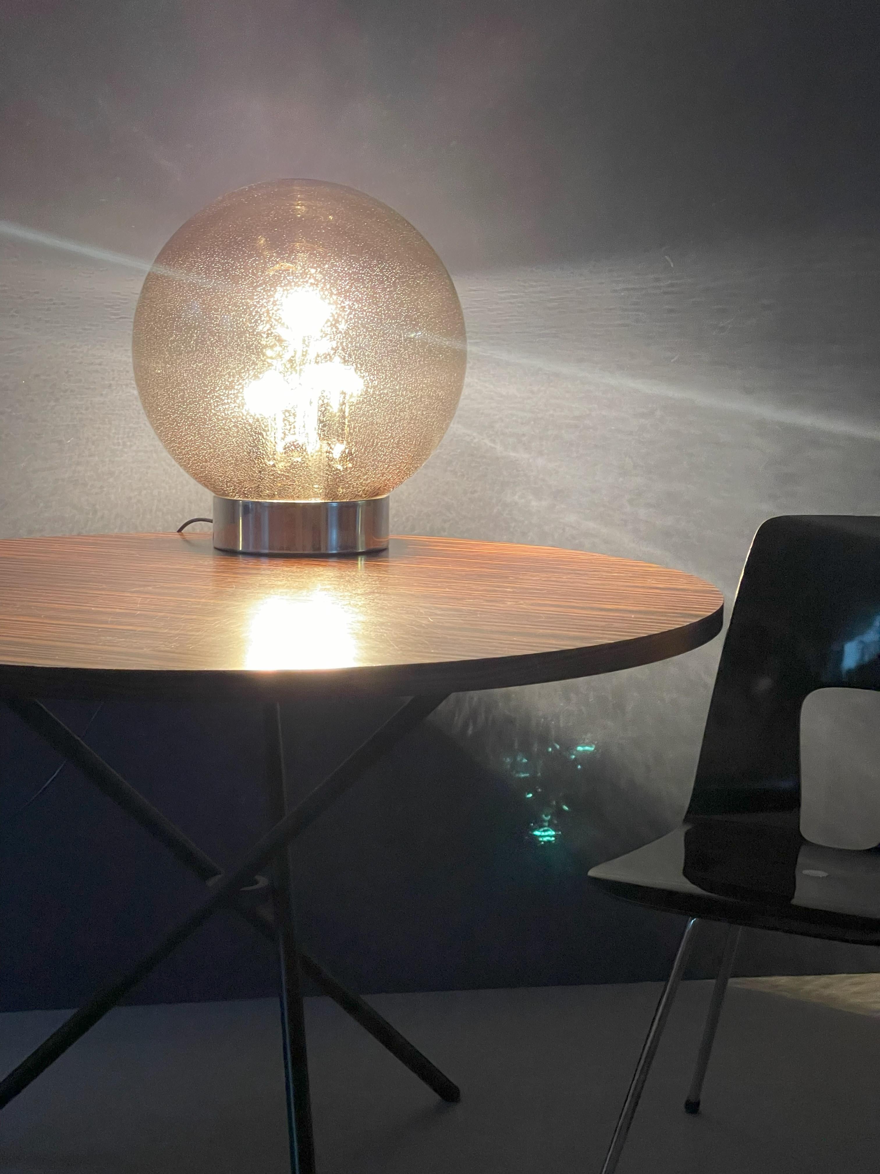 Illuminate your space with design and warmth through our glass globe lamp—a stylish fusion of contemporary design and timeless charm.