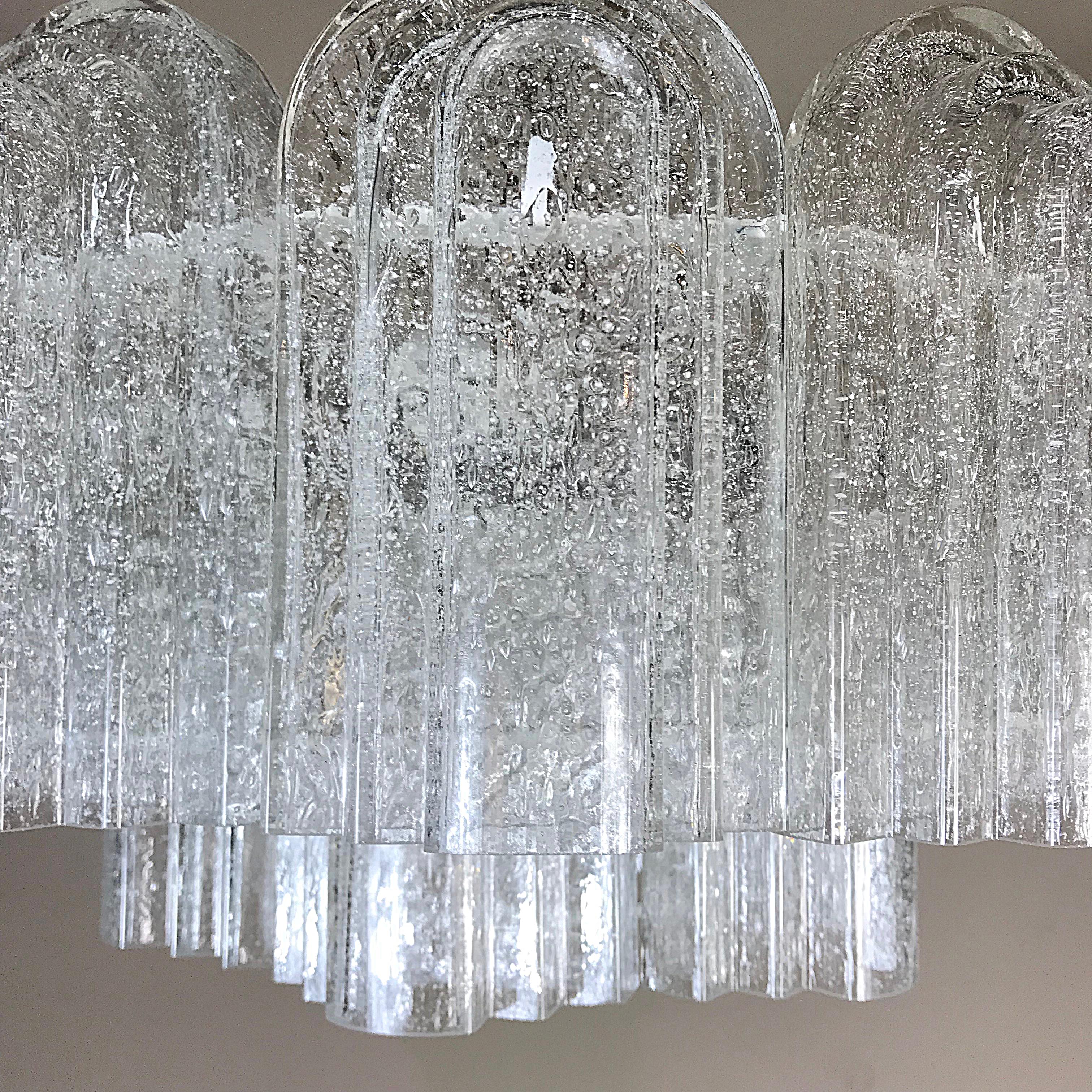Beautiful midcentury chandelier manufactured by Doria in 1960s, Germany. It's featuring stepped blown glass hangers and elements with polished brass hardware. Fully working and tested condition with one Edison E27 and six E14 sockets, the lamp works