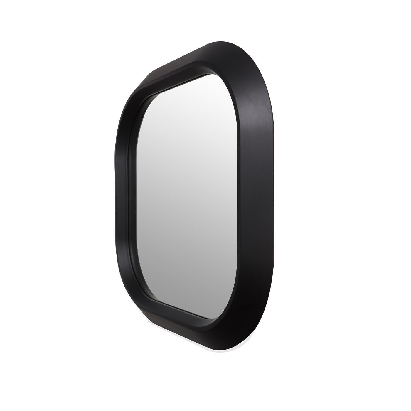 A clean and essential design that will add a luminous accent to any wall in a modern home, this mirror flaunts a sleek silhouette enclosed in a matte, black-lacquered MDF frame marked by a squared shape and rounded corners. Timeless and versatile,
