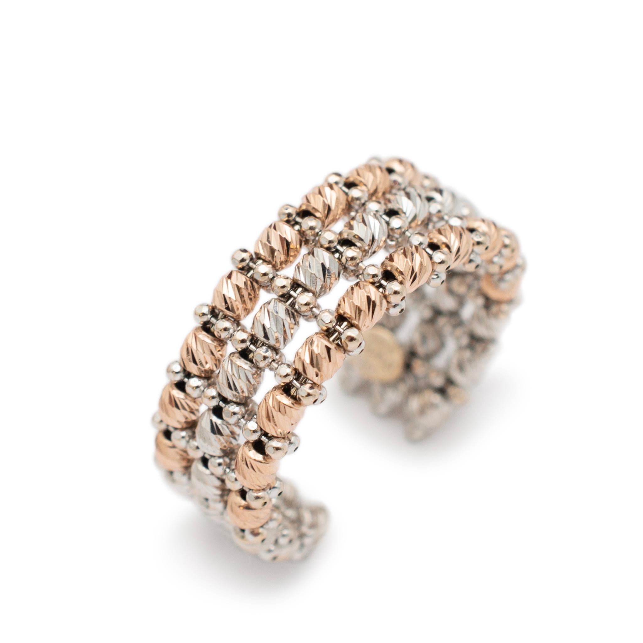 Gender: Ladies

Metal Type: 18K Yellow & White Gold

Size: Adjustable

Width: 8.60 mm

Weight: 4.90 grams

Ladies 18K white & yellow gold three-row band with an adjustable shank.Engraved with 