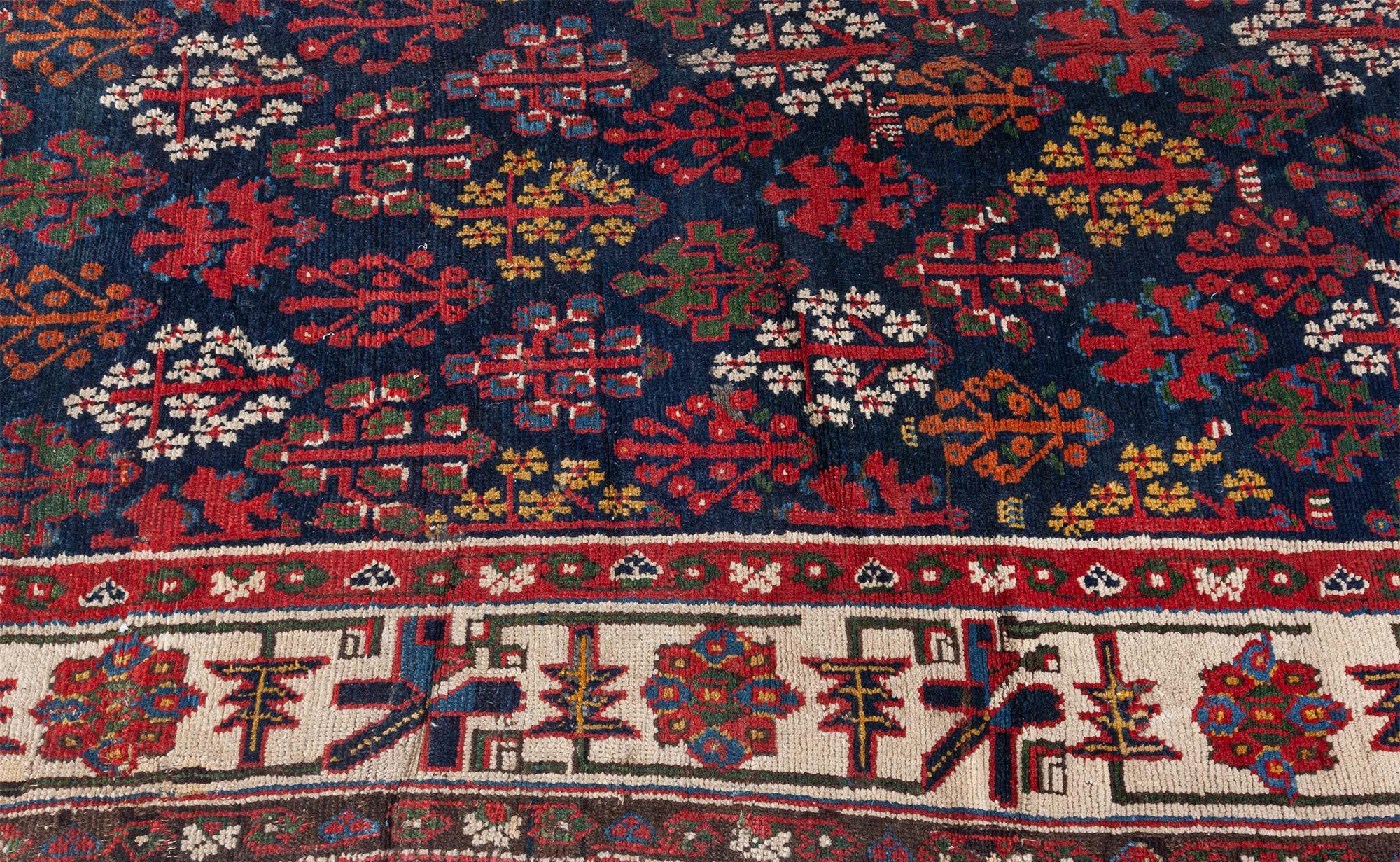19th century North West Persian botanic handwoven wool rug
Size: 5'0