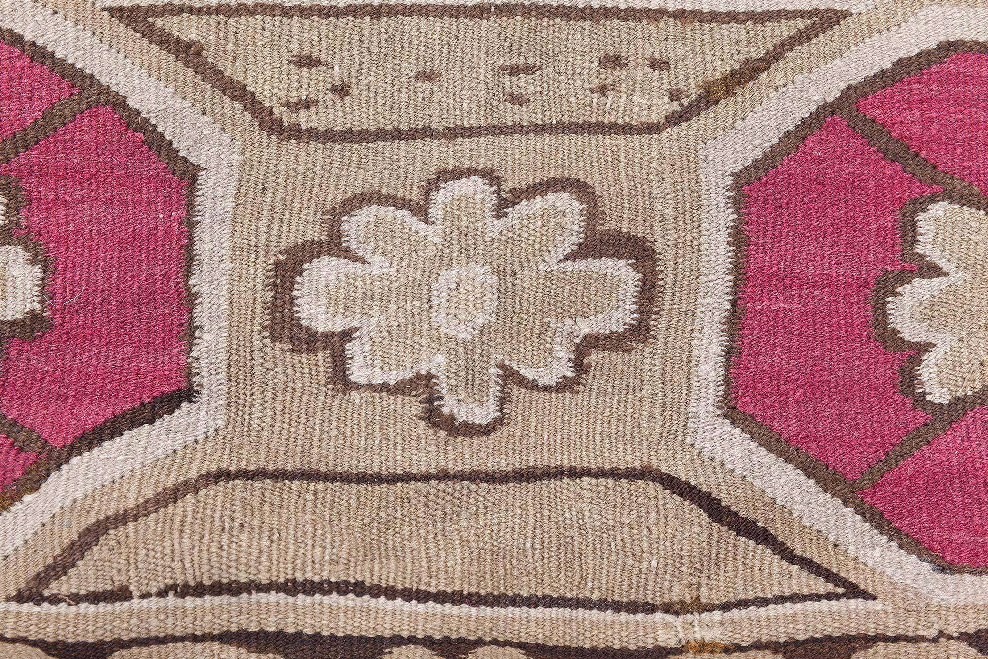 19th century Ukrainian rose and beige handwoven wool carpet.
Size: 6'7