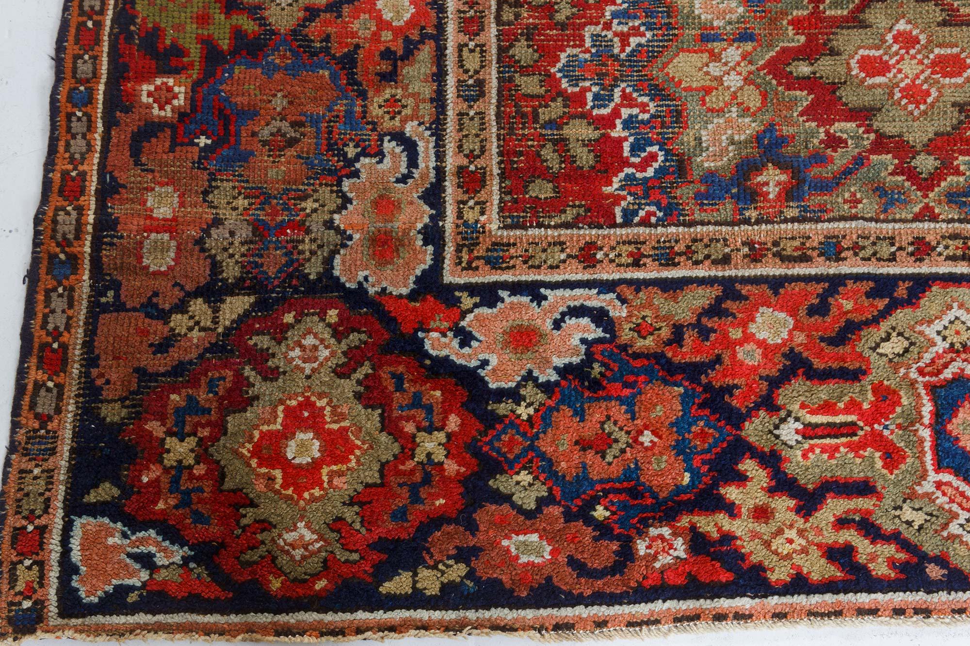 Antique Axminster Botanic red, blue and beige handwoven wool rug.
Size: 11'4