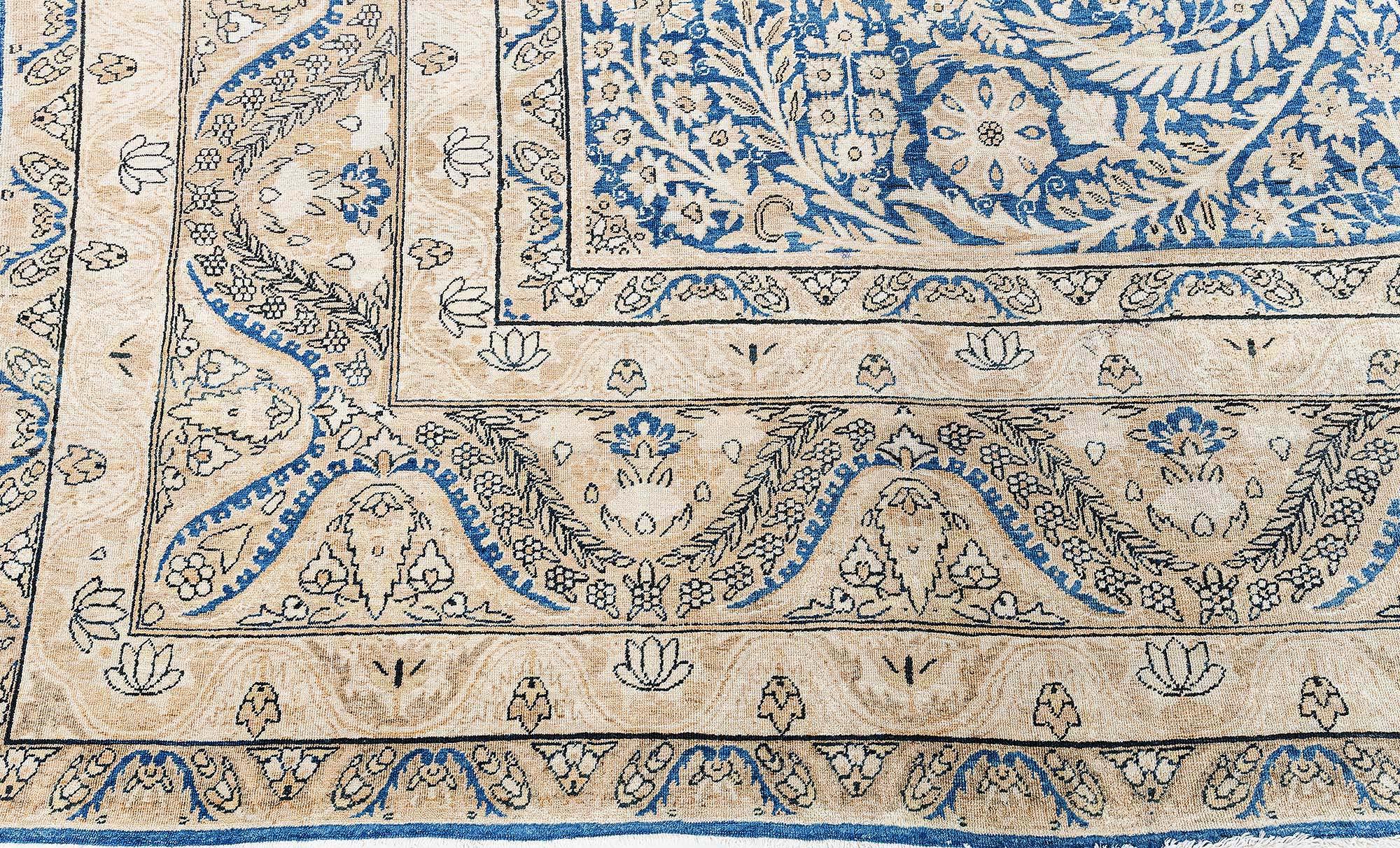 Tappeto persiano antico Kirman blu in lana fatto a mano
Dimensioni: 10'3
