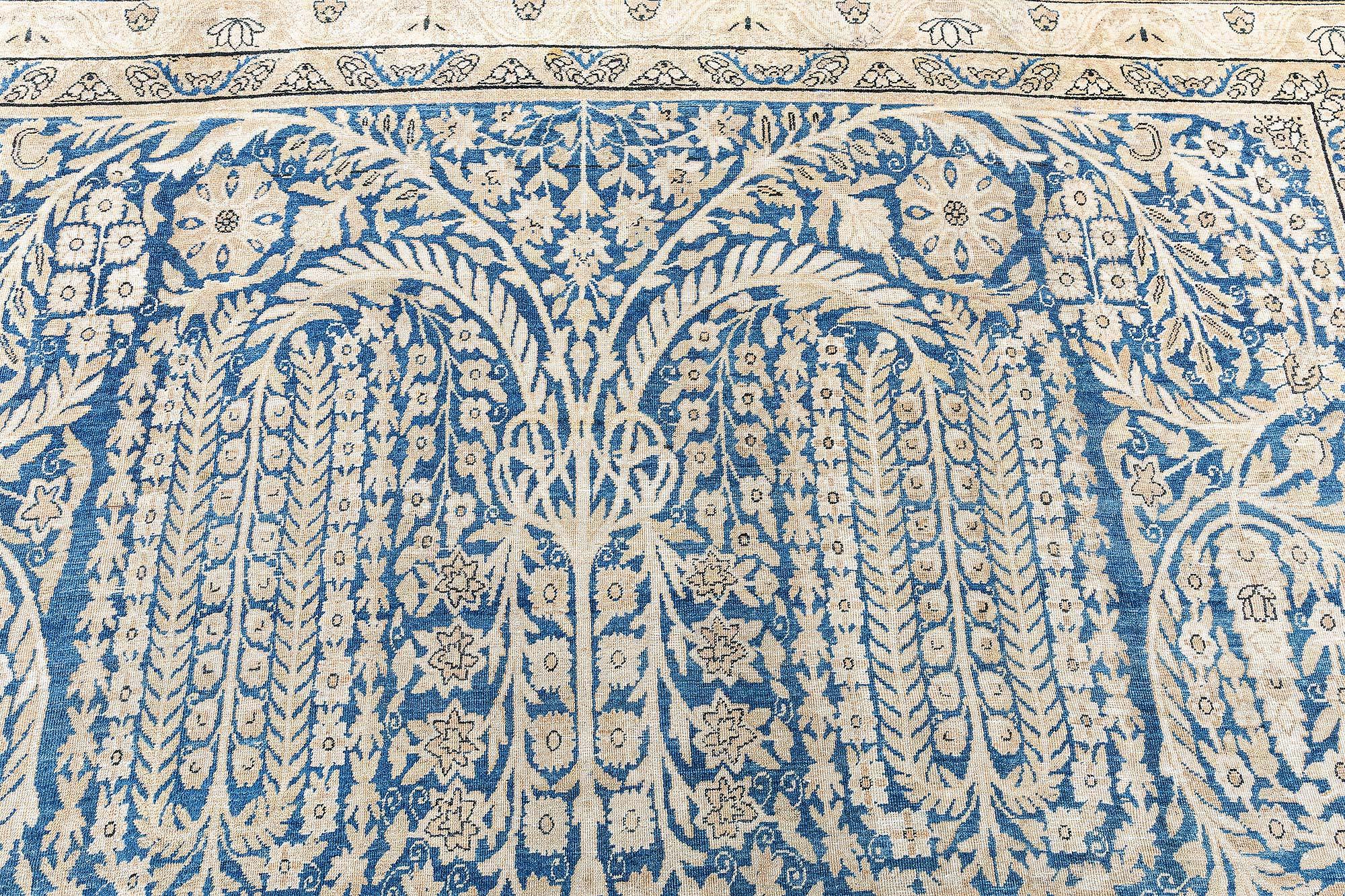 Tappeto persiano antico Kirman blu in lana fatto a mano
Dimensioni: 10'3