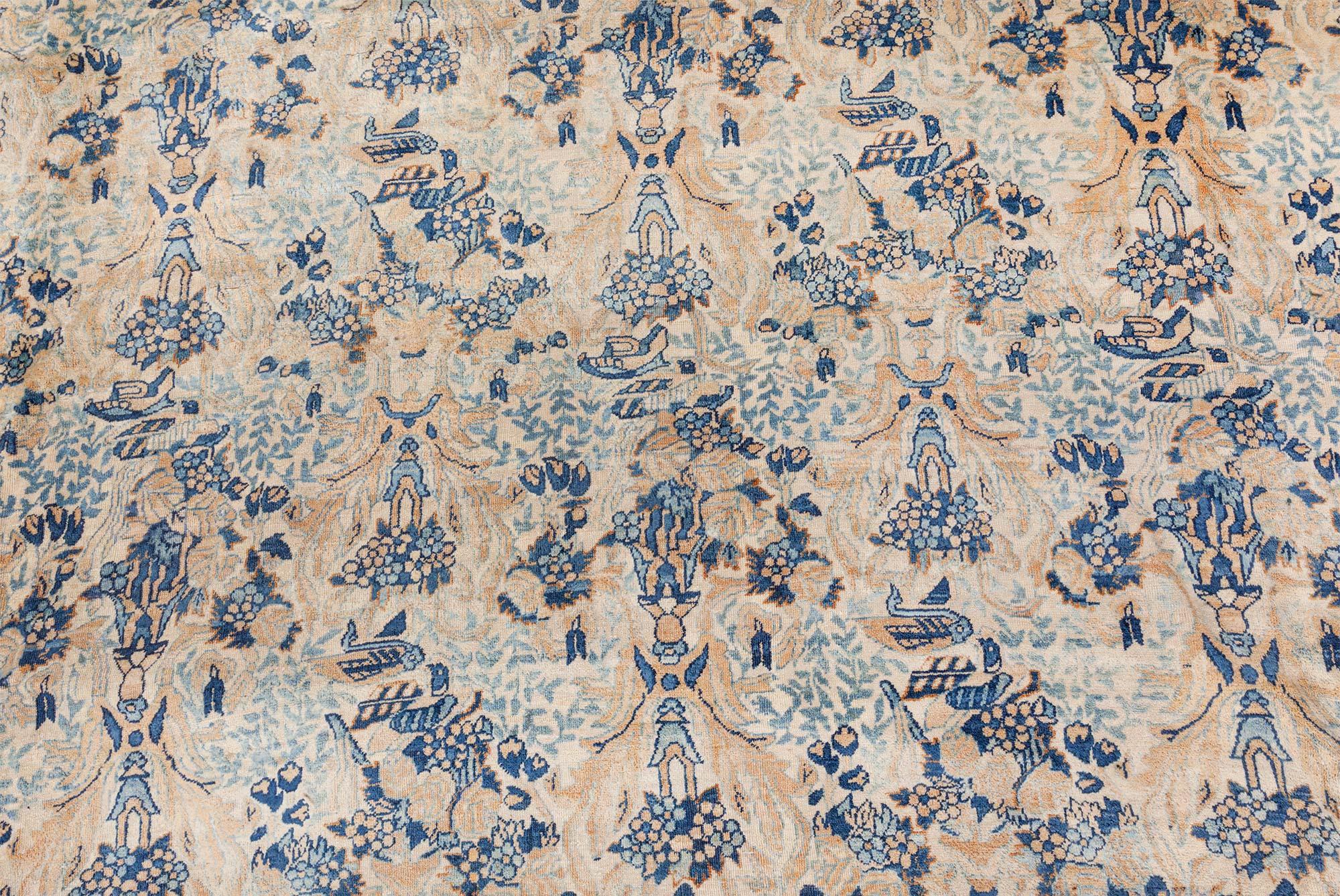 Tappeto antico persiano Kirman beige e blu in lana fatto a mano
Dimensioni: 11'10