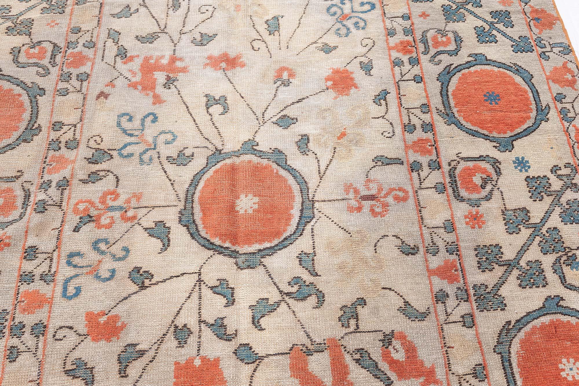 19th century Samarkand beige and orange handwoven wool rug.
Size: 5'2