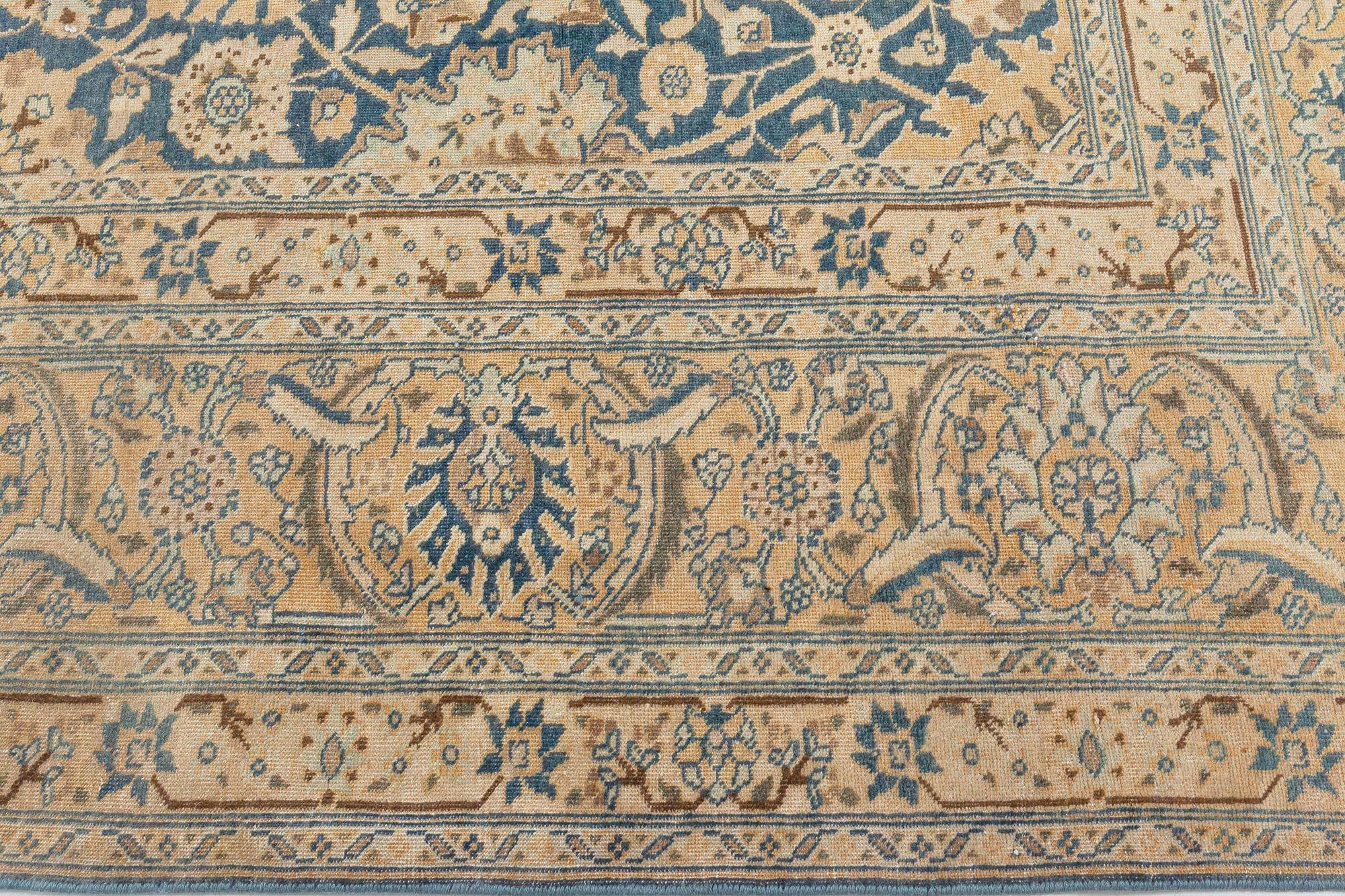 Antique Persian Tabriz Royal blue and caramel wool rug
Size: 9'0