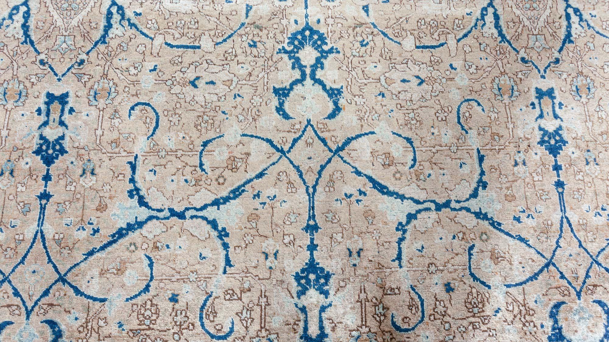 Antique Persian Tabriz rug.
Size: 11'2