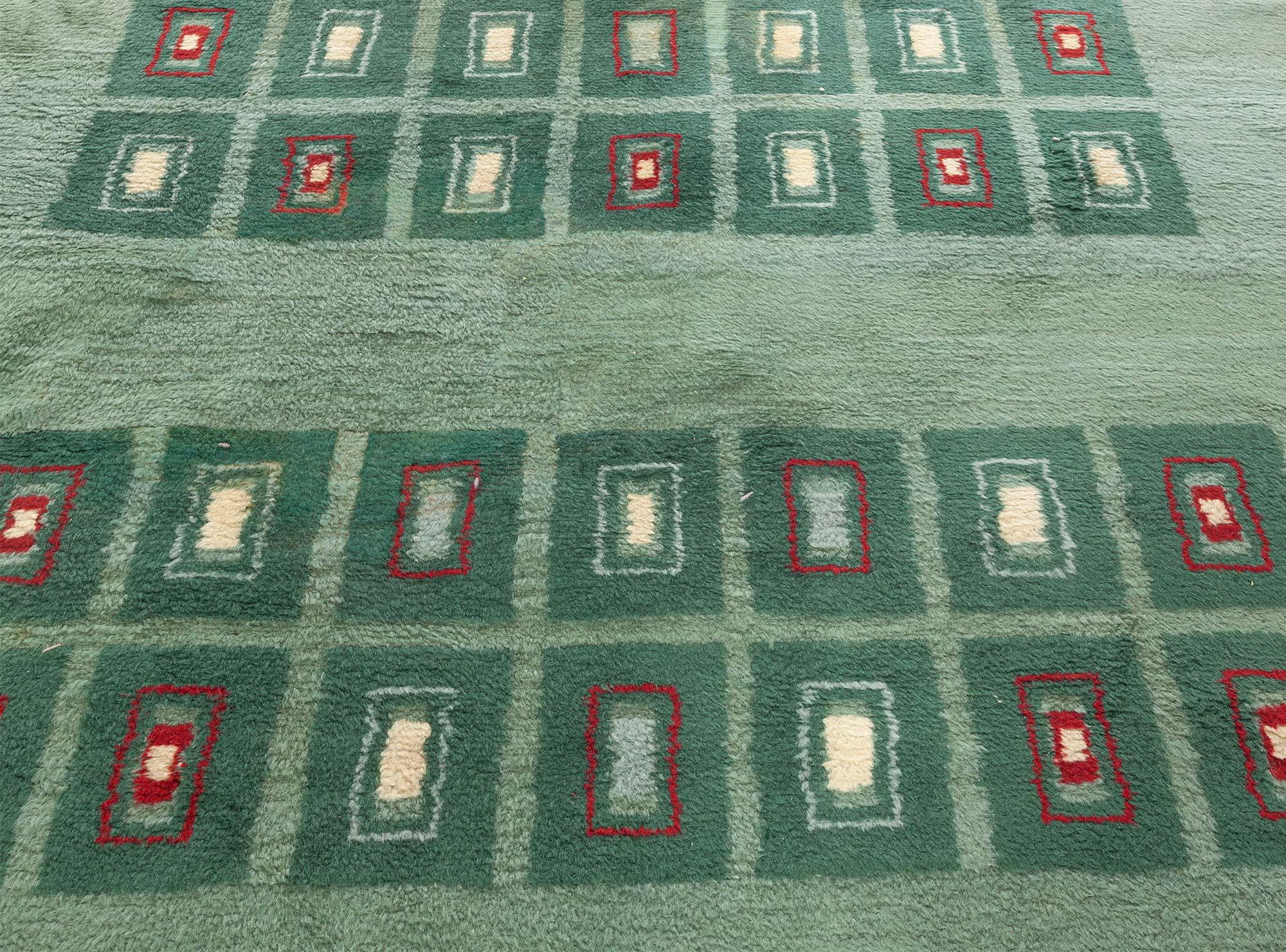 Early 20th century French Art Deco green handmade wool rug
Size: 5'7