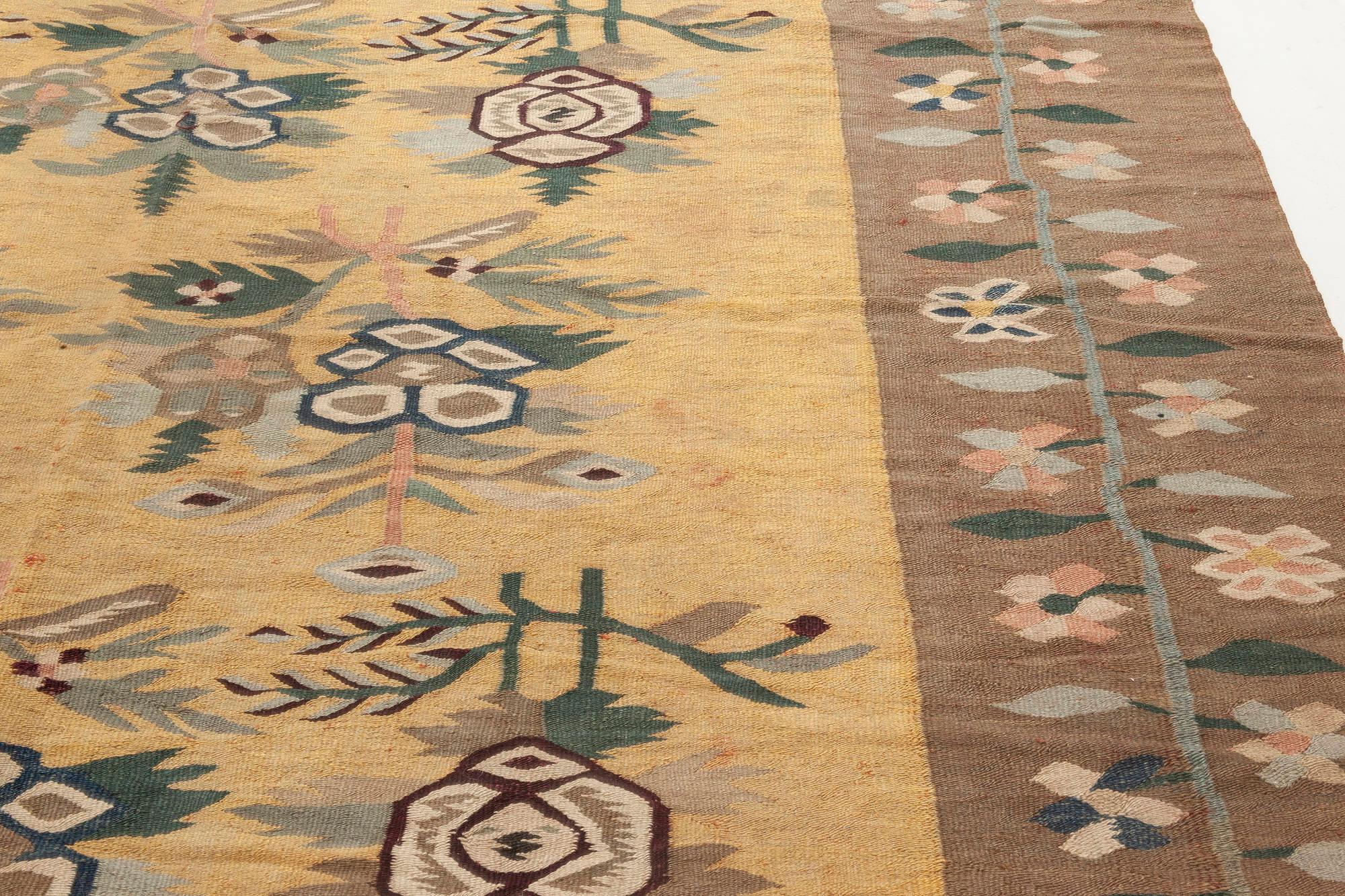 Early 20th century Bessarabian floral brown, green, pink and yellow rug
Size: 5'10