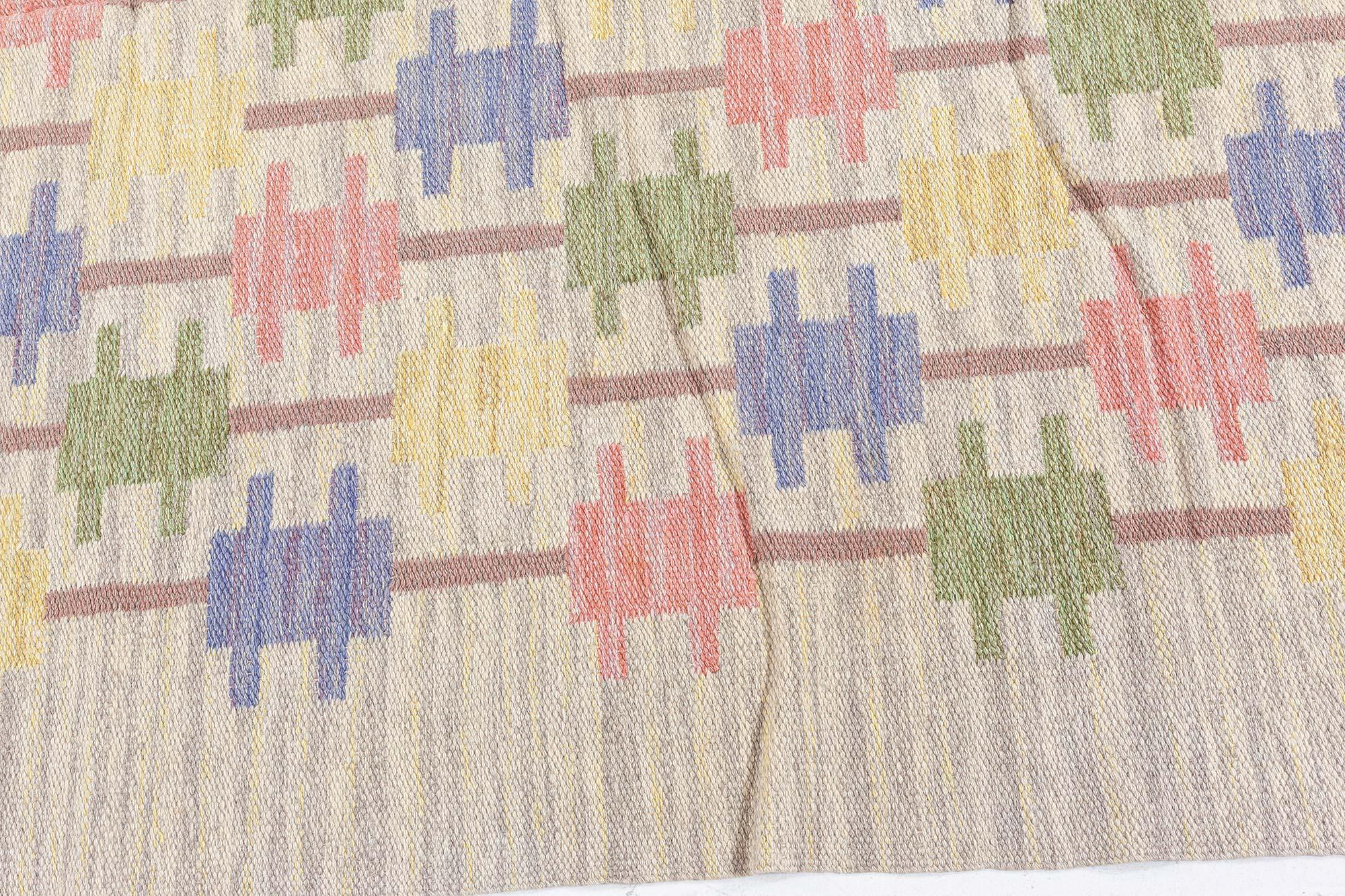 Mid-20th century Swedish beige, blue, green, red and gray flat-weave wool rug
Size: 5'5