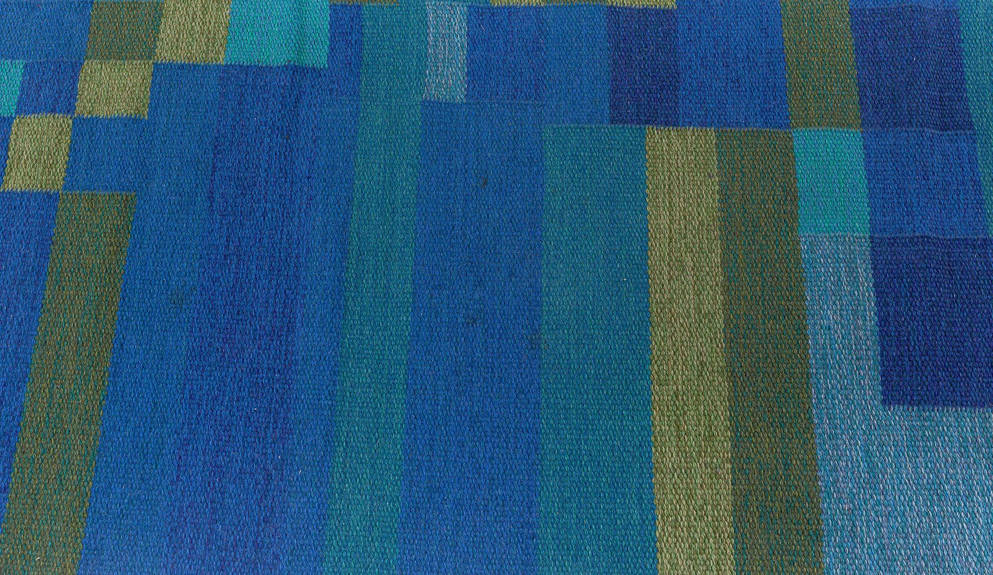 Mediados del siglo XX Alfombra sueca geométrica de lana verde y azul de tejido plano Firmada AB
Tamaño: 172 x 241 cm (5'8