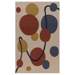 Tapis Doris Leslie Blau d'inspiration Art Déco beige, noir, bleu, or, rouge, en laine