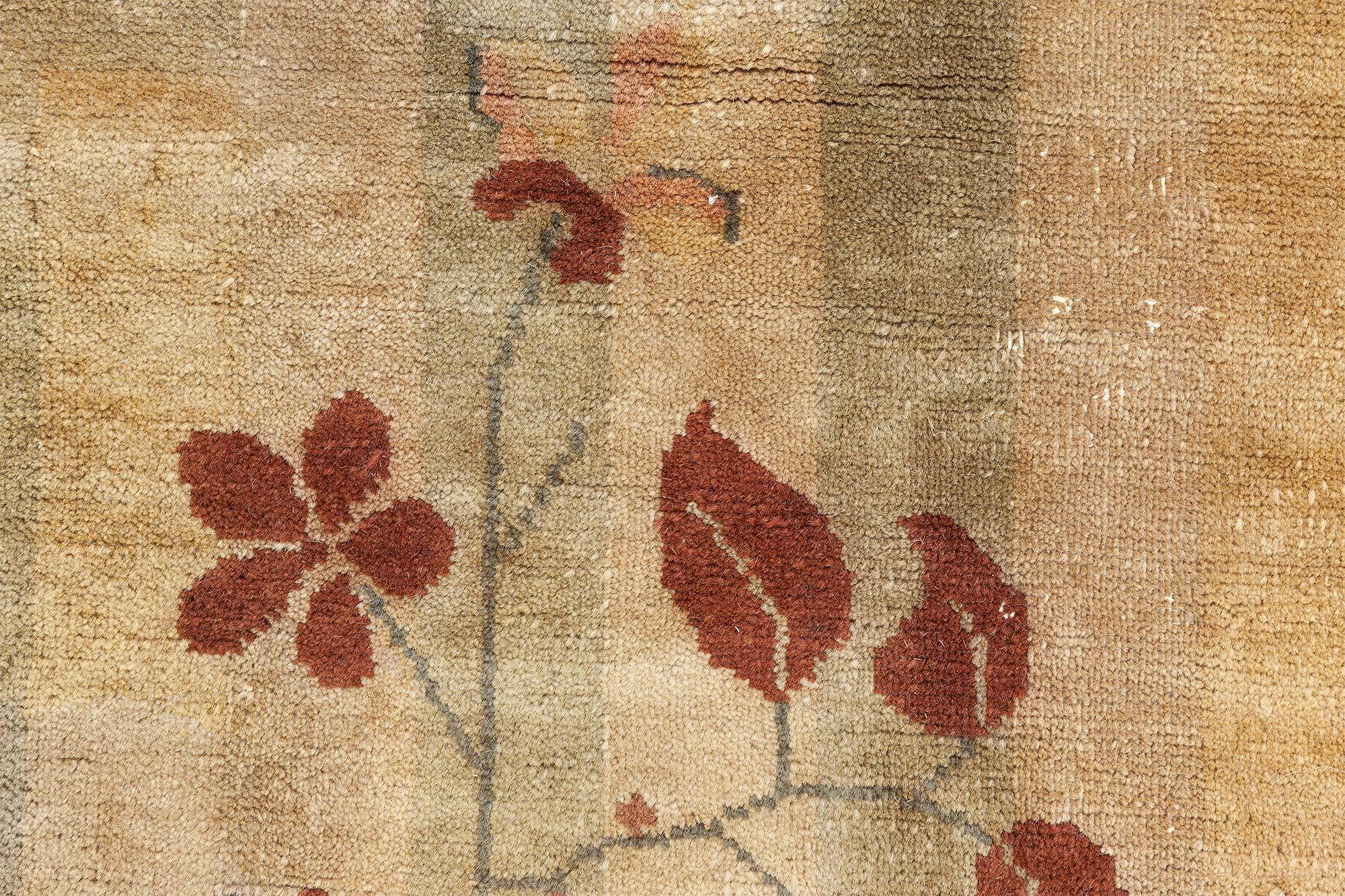Vintage French Art Deco handwoven wool rug
Size: 11'8” x 13'2” (355 x 401 cm)
An exceptional early 20th century French Art Deco modern carpet, the sand field with scattered red, brown and beige geometric and floral motifs, including grids and