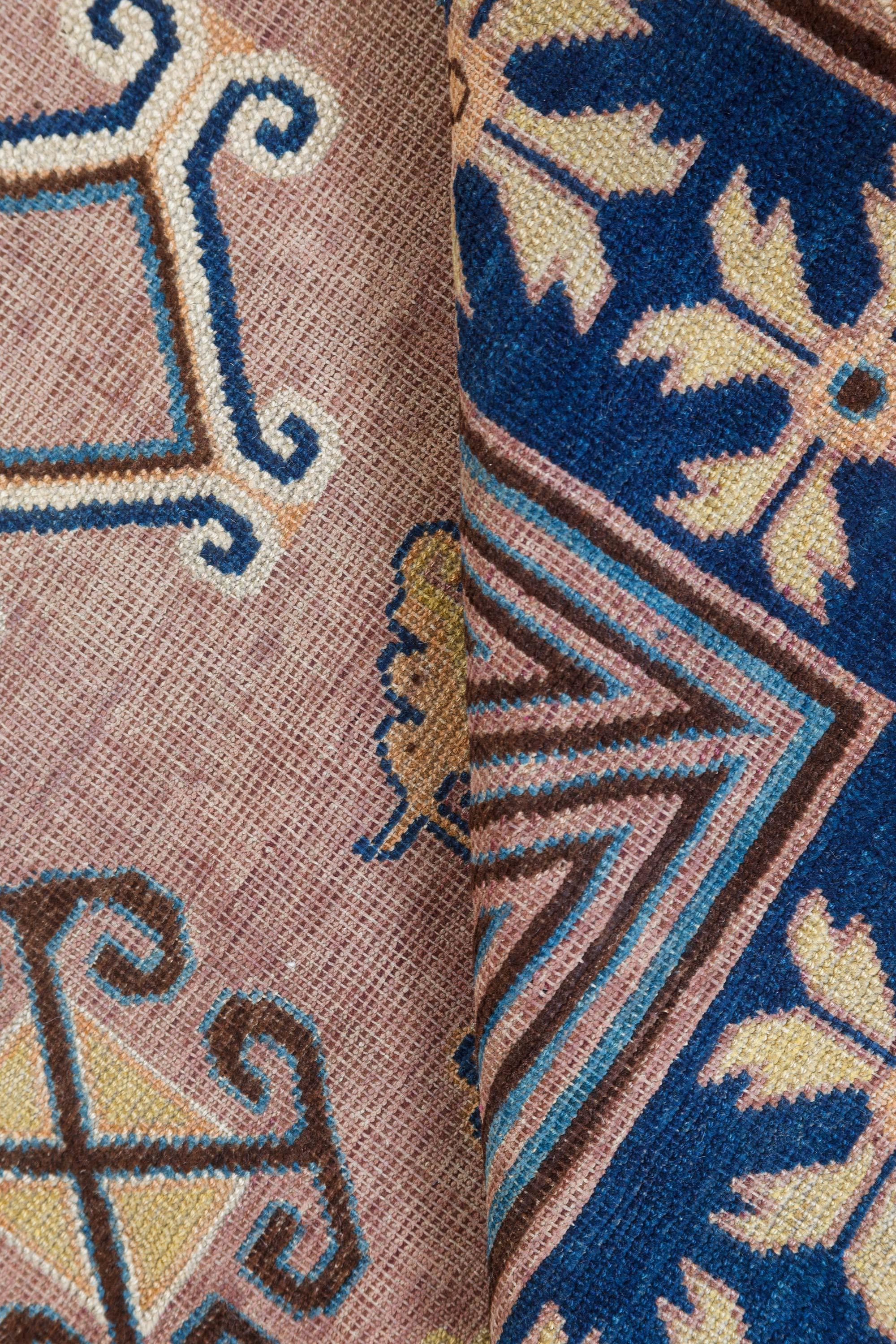 Vintage Samarkand 'Khotan' braun, blau handgefertigter Wollteppich.
Größe: 4'7