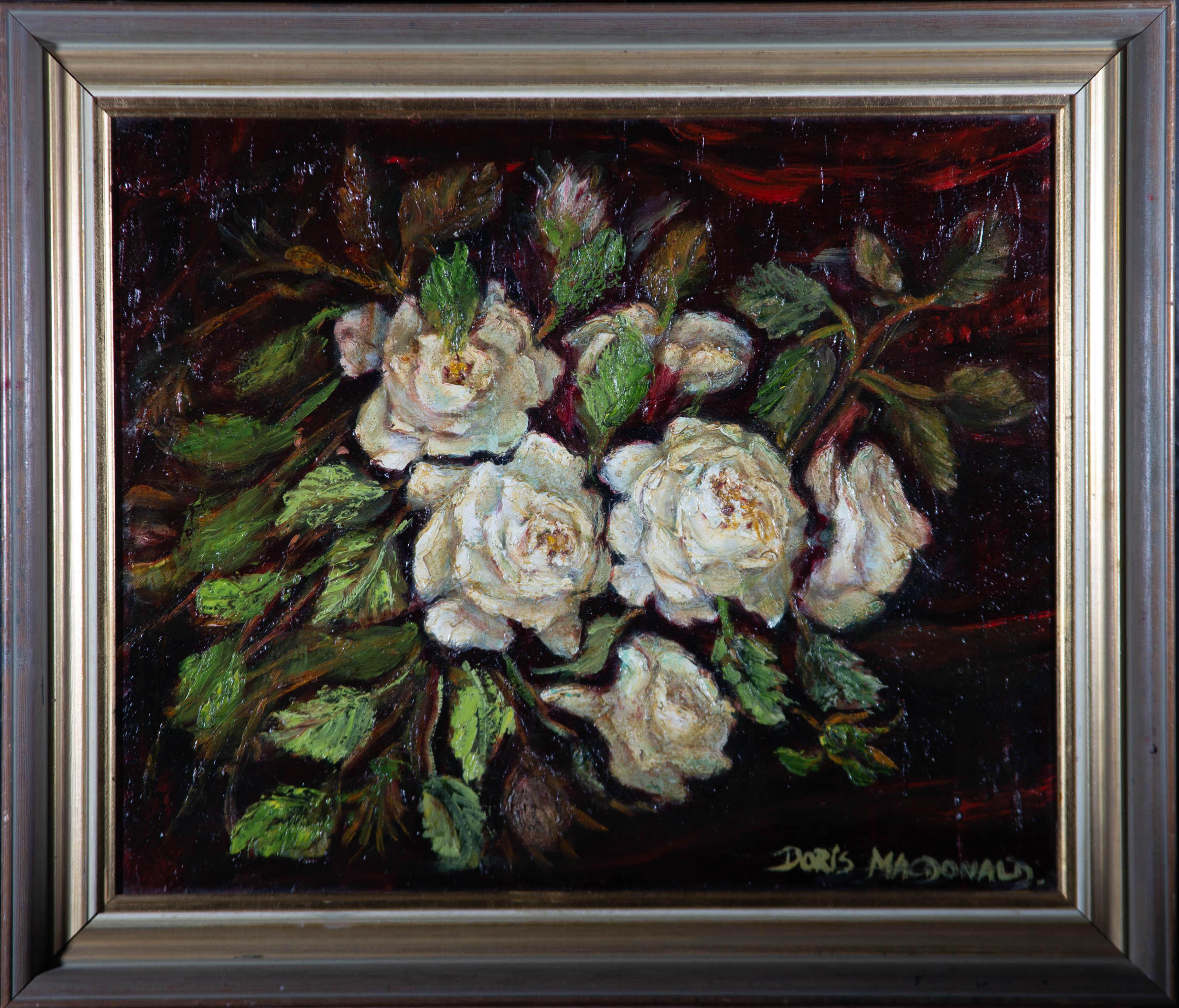 A charming impasto oil painting by Doris MacDonald, depicting a still life scene with white roses. Signed to the lower right-hand corner. There is a label on the reverse inscribed with the artist's name and title. Well-presented in a wooden frame